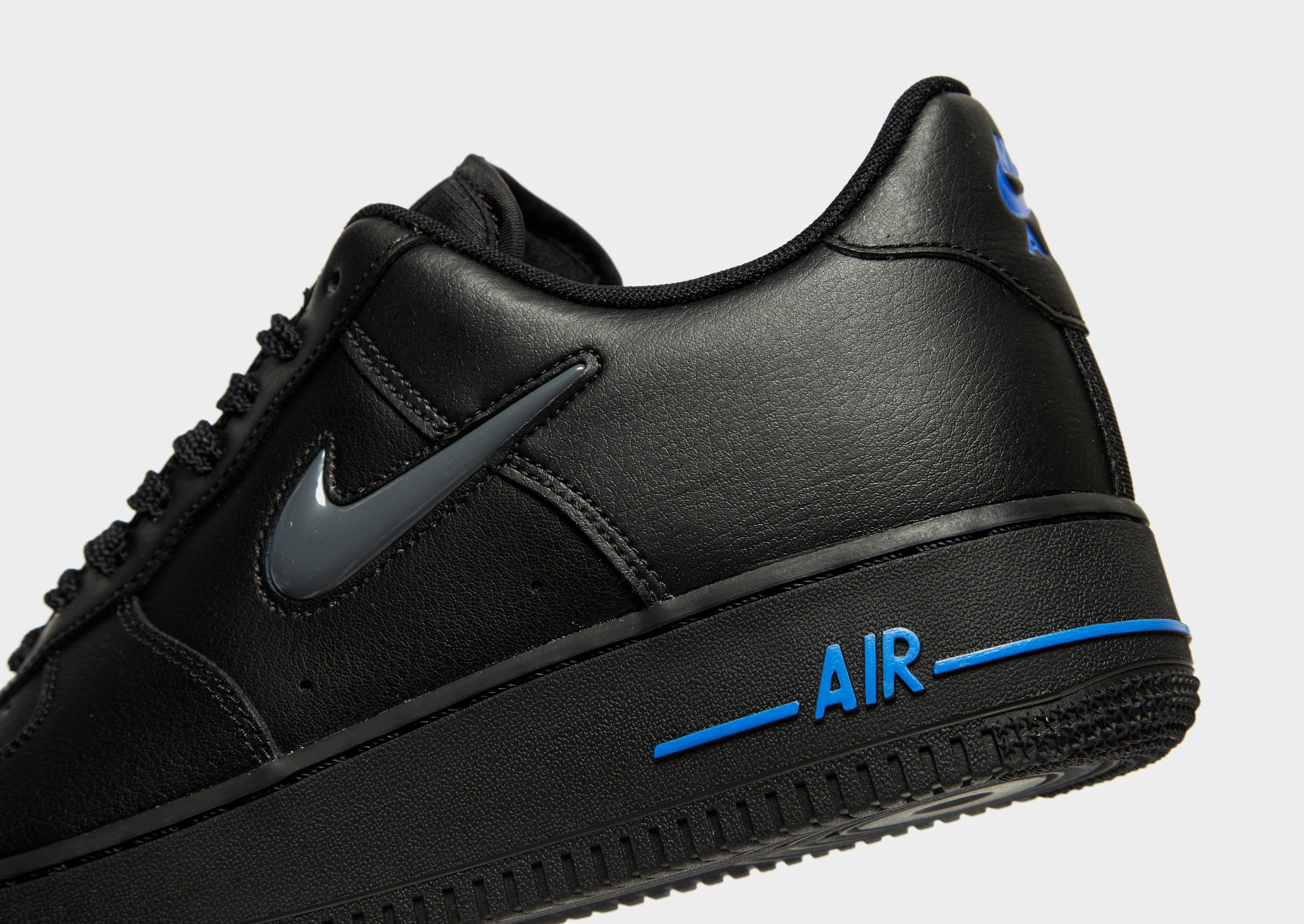 black air forces with blue nike sign