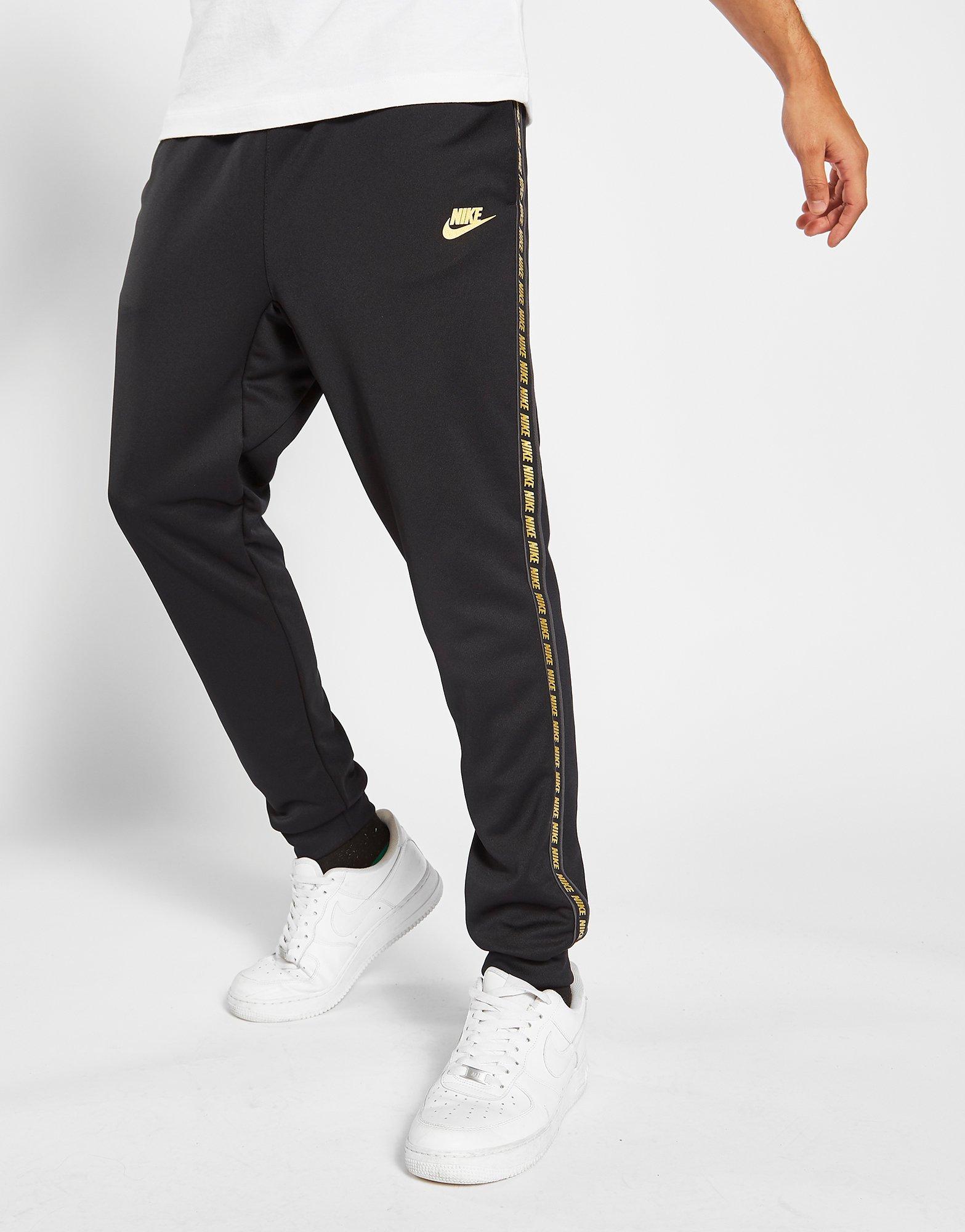 nike tape poly track pants gold