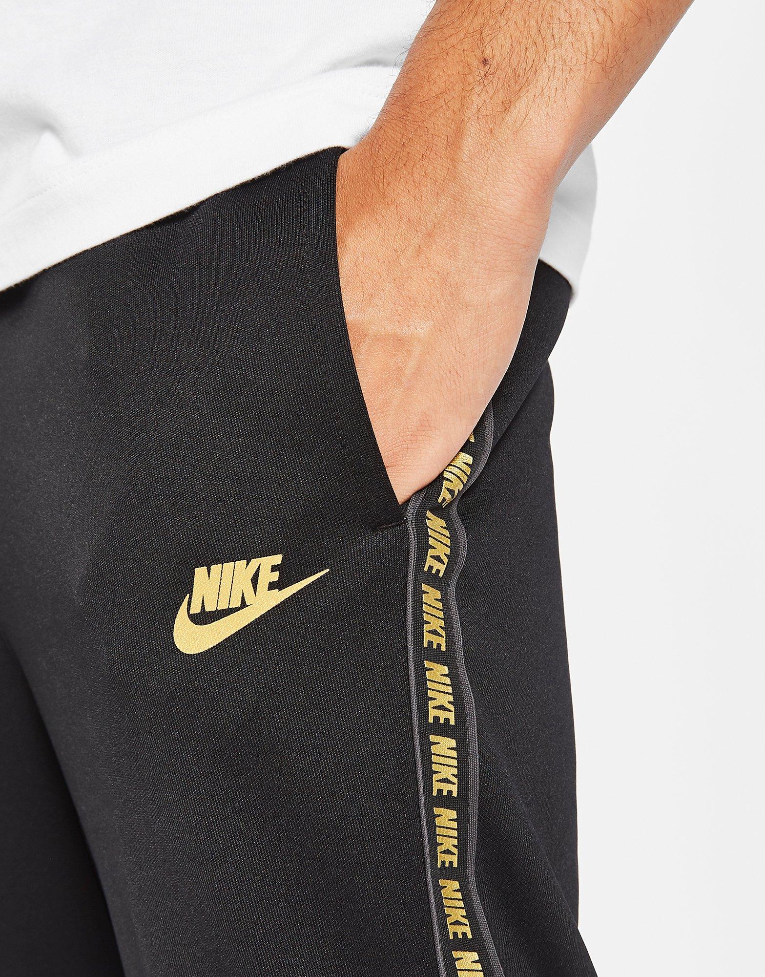 nike taped poly track pants black