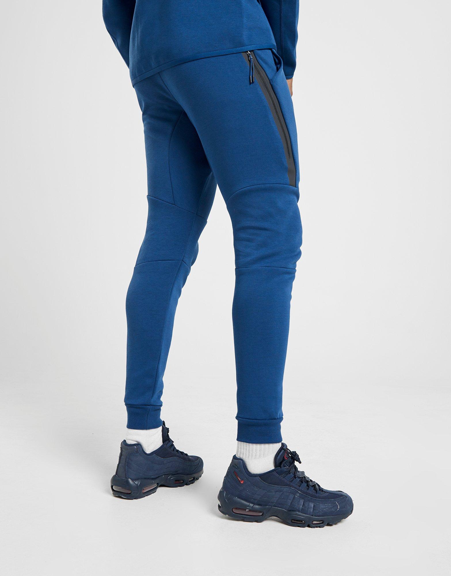 nike tech joggers blue