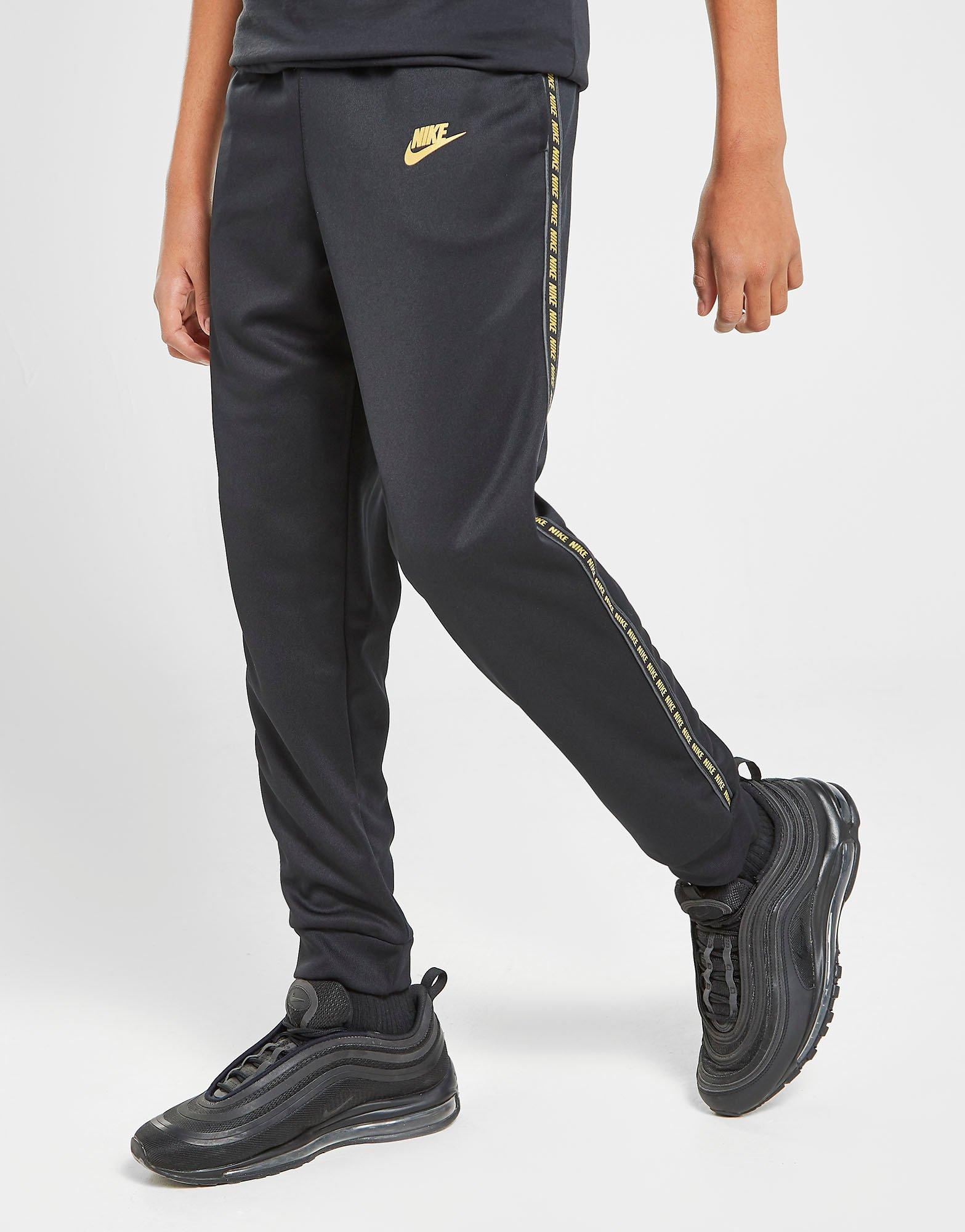 nike tape poly track pants gold