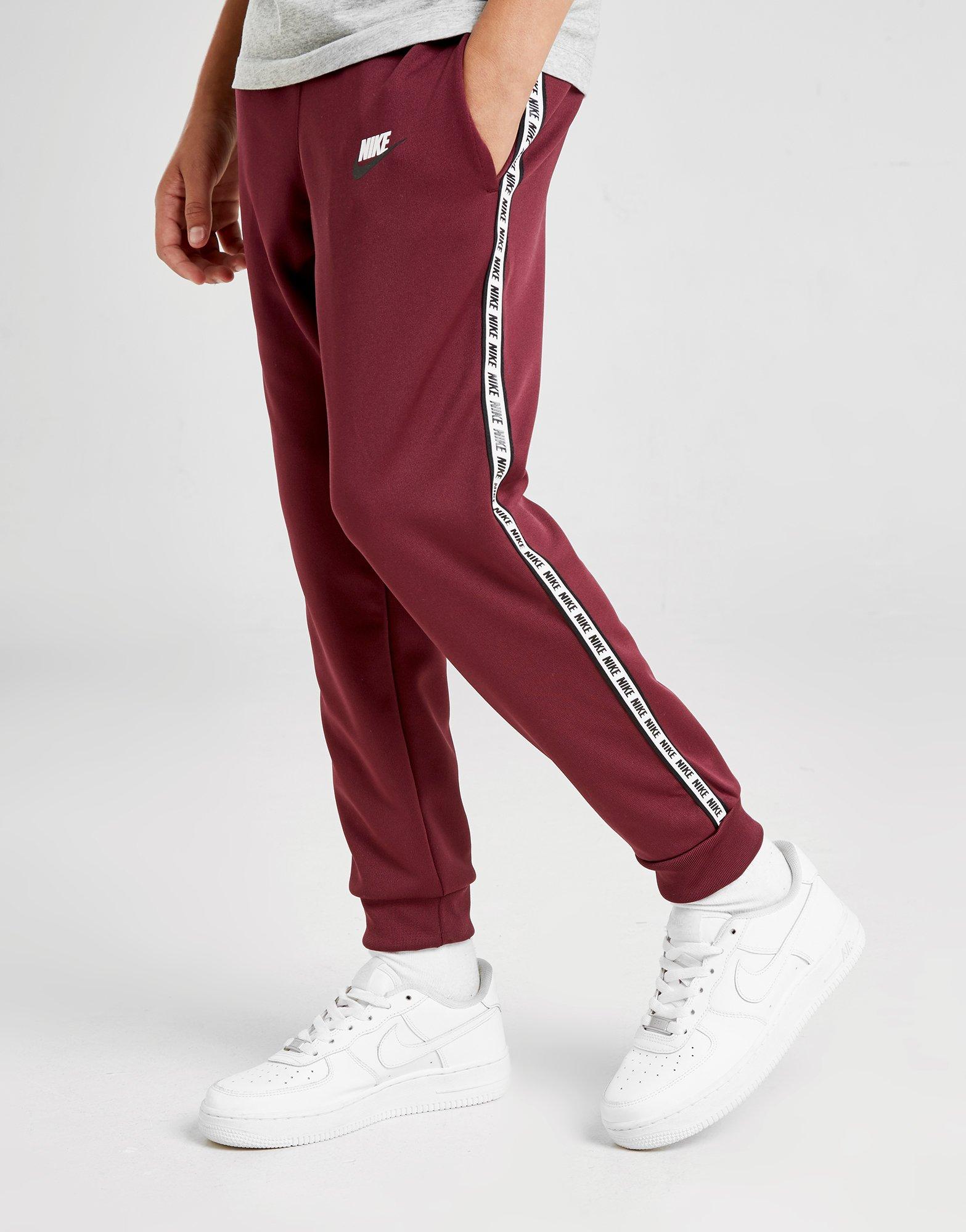 nike taped poly track pants red