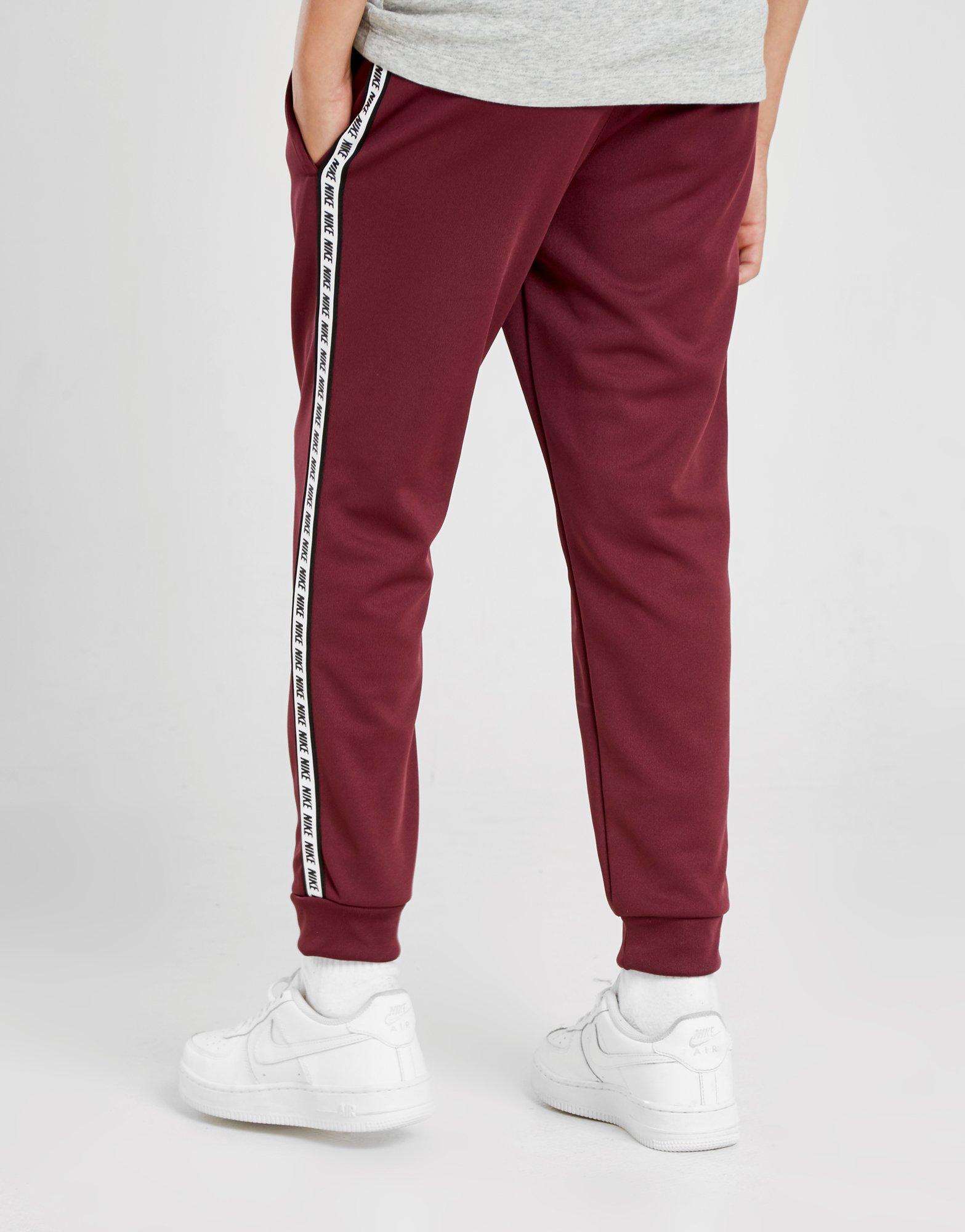 nike taped poly track pants red