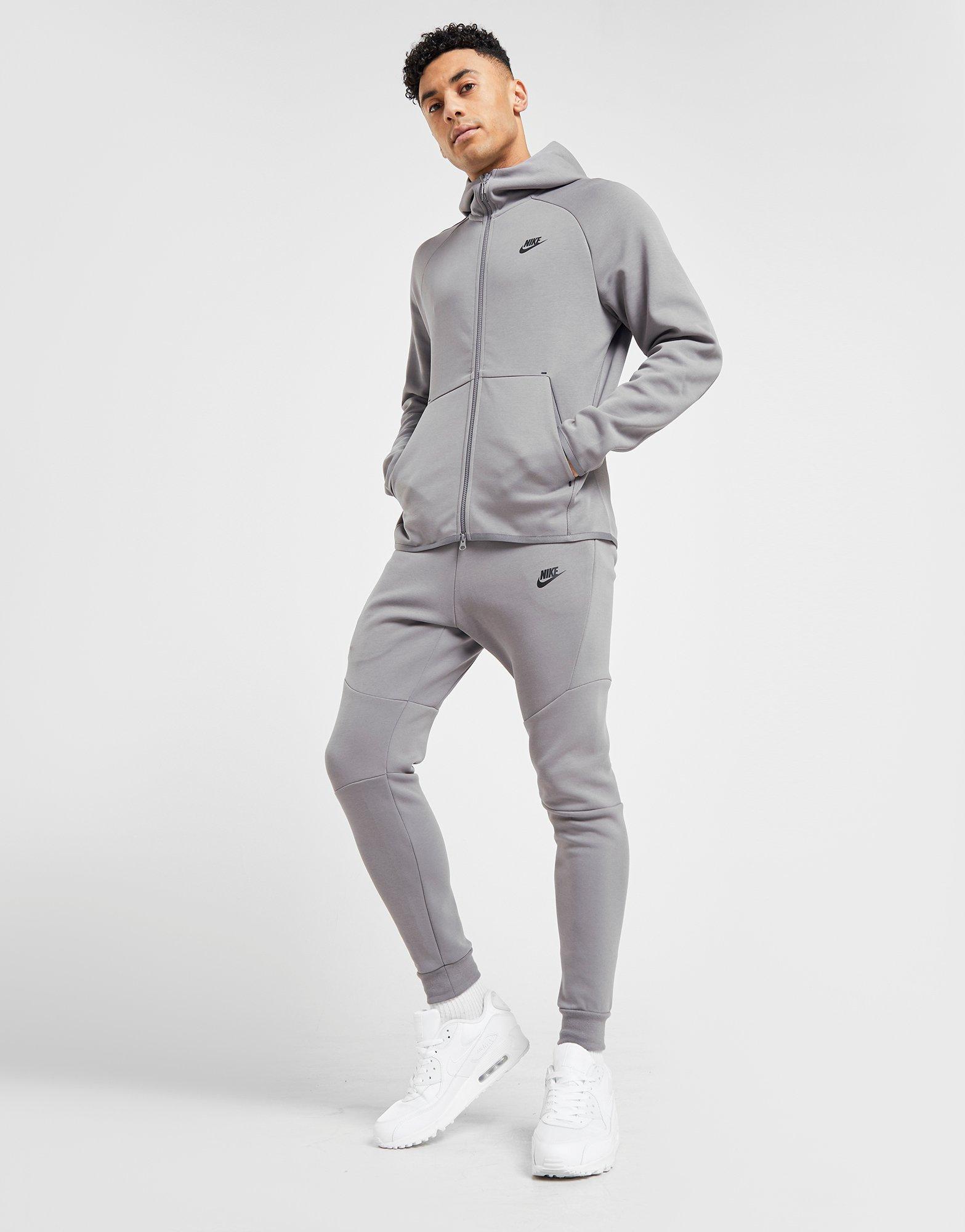 grey nike tech tracksuit