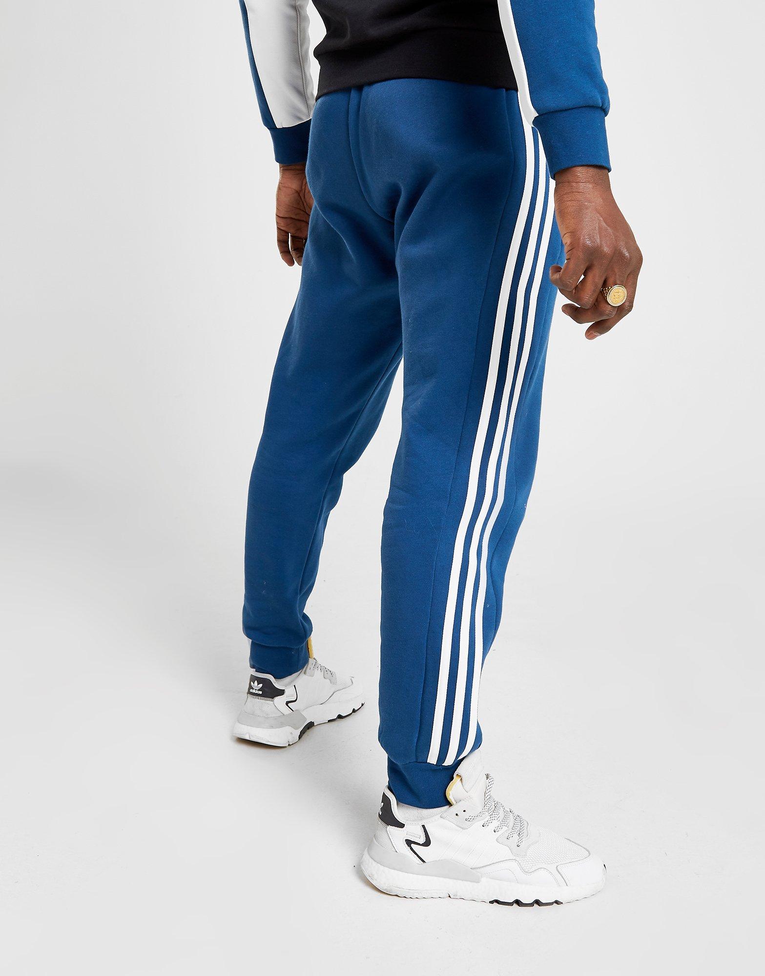 jogging adidas gris bande bleu