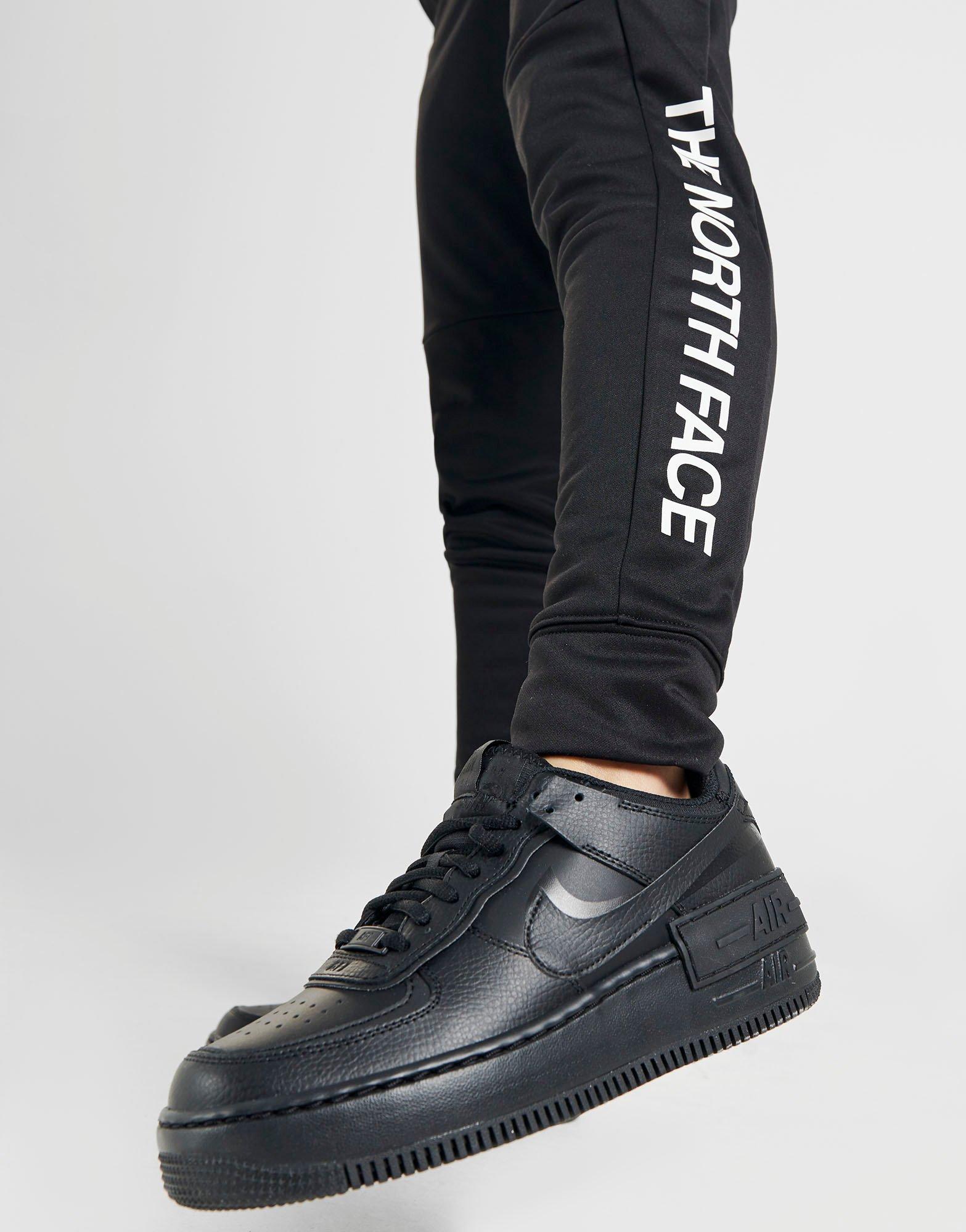 the north face train n logo track pants white