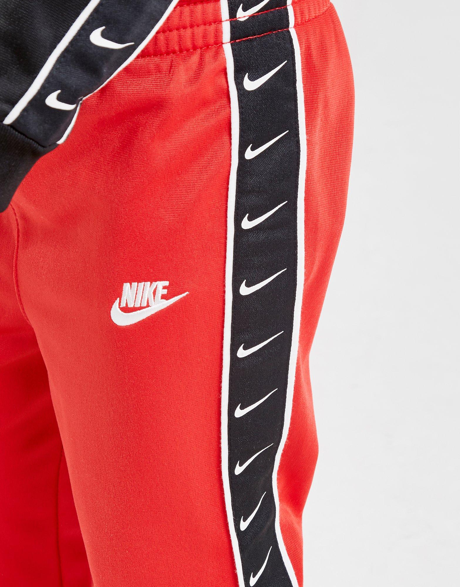 nike swoosh tape track pants