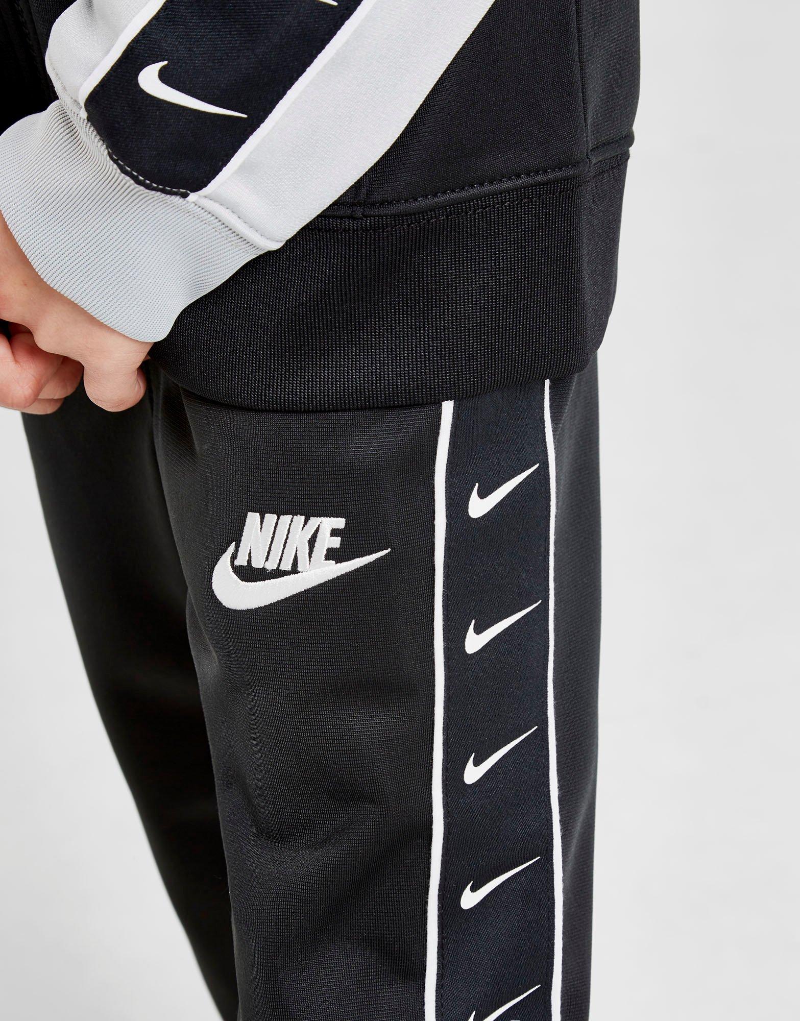 nike swoosh tape tracksuit