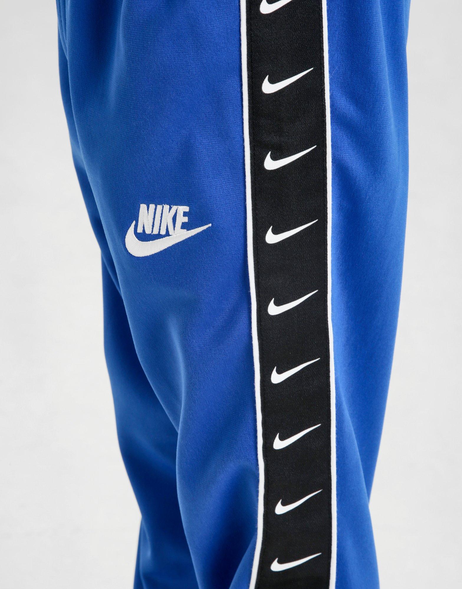 nike swoosh tape track pants