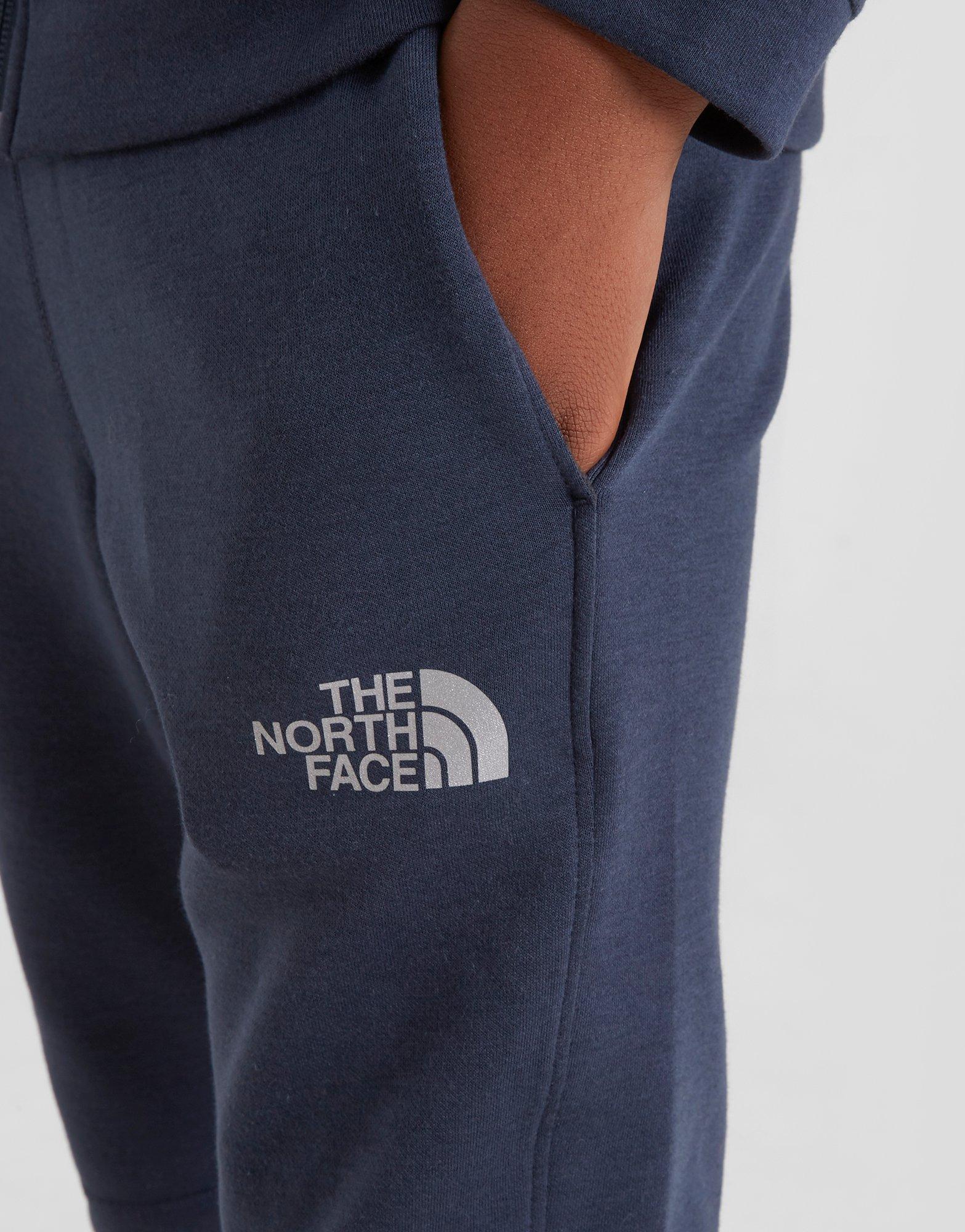 blue north face tracksuit bottoms