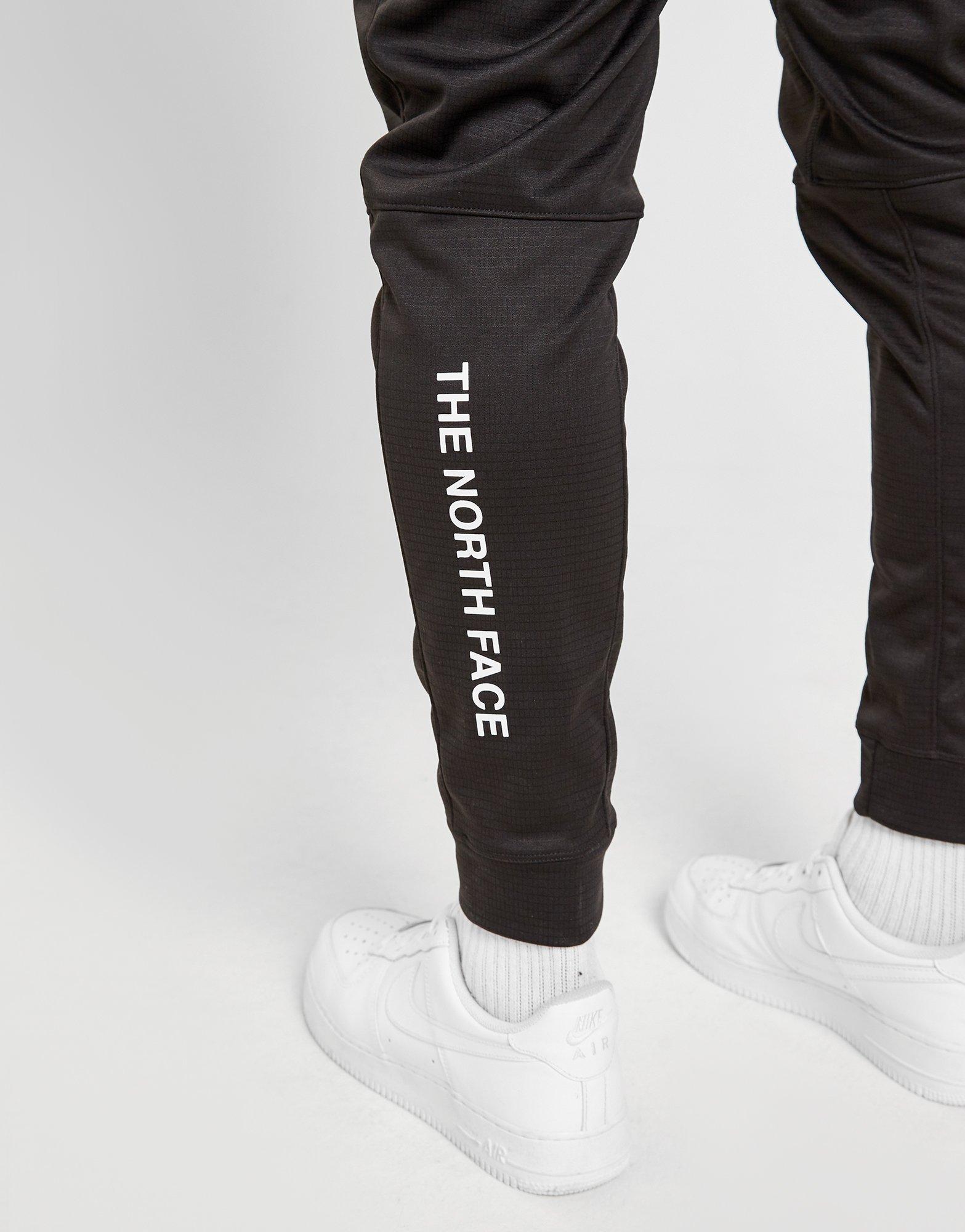 the north face train n logo track pants white