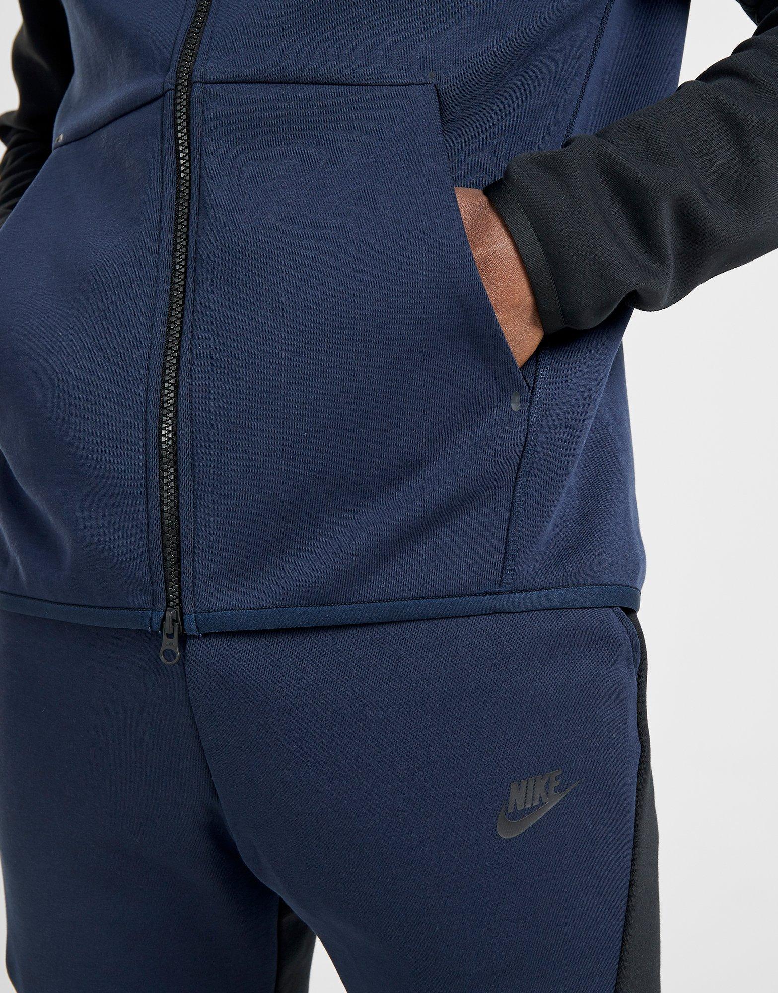blue and black nike tech tracksuit