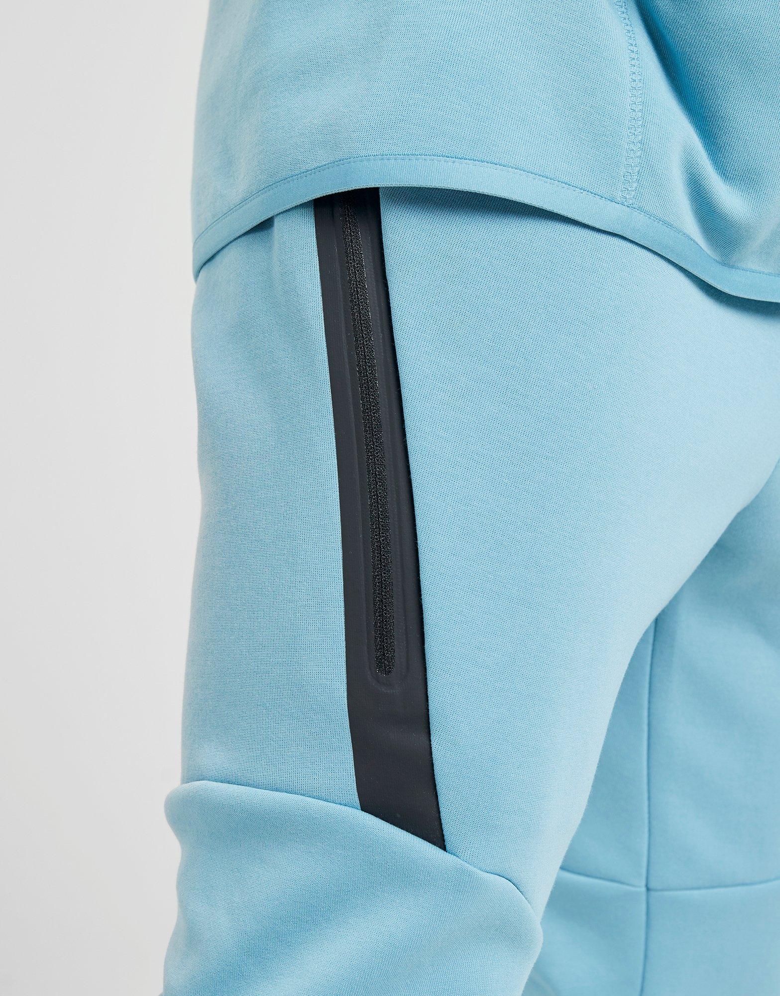 nike tech tracksuit light blue