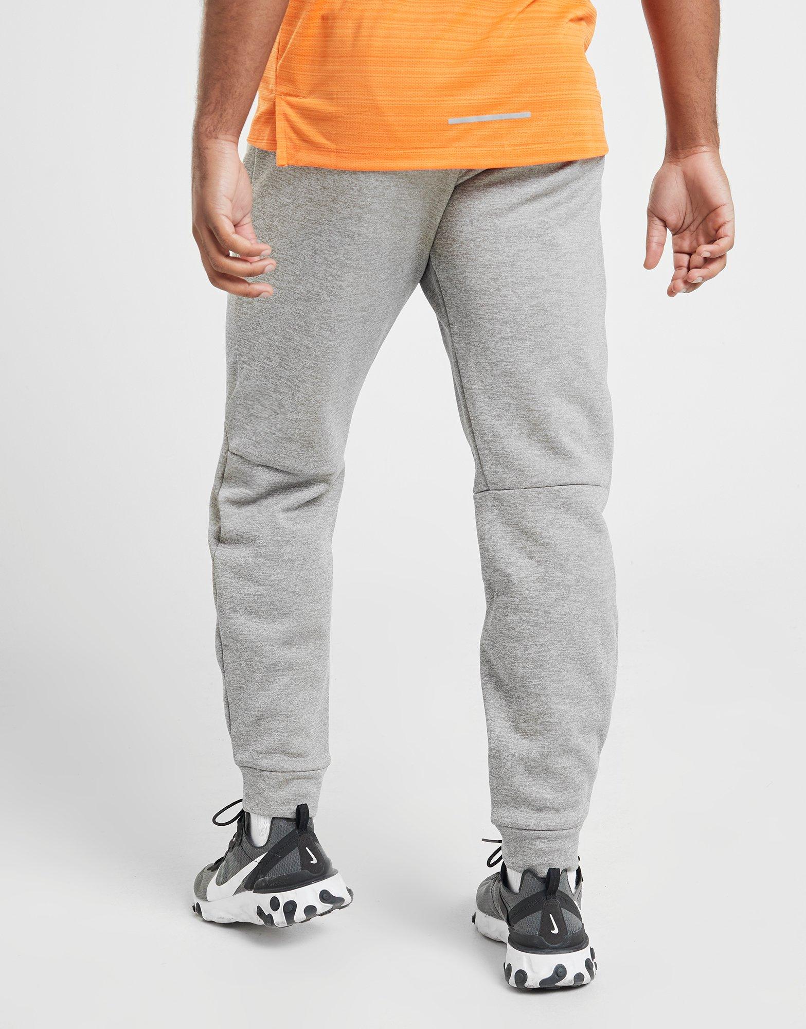 nike training therma tapered joggers in black