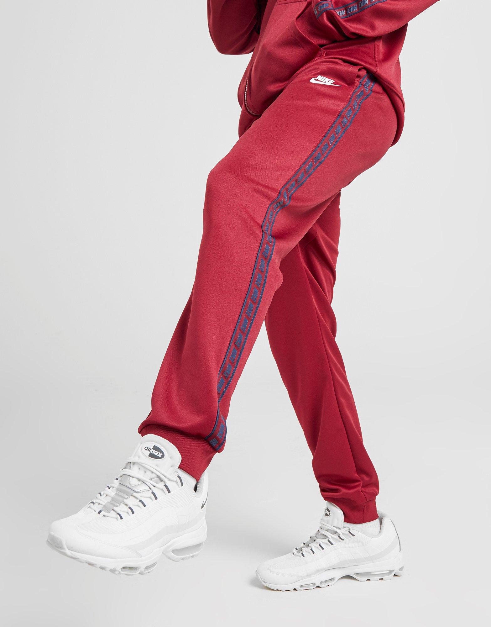 nike repeat print track pants