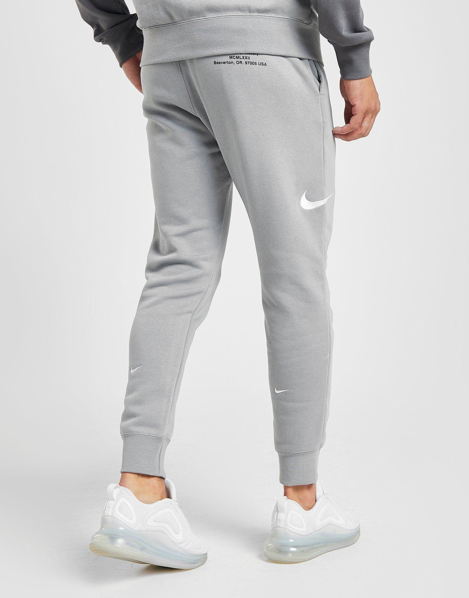 nike swoosh tracksuit grey