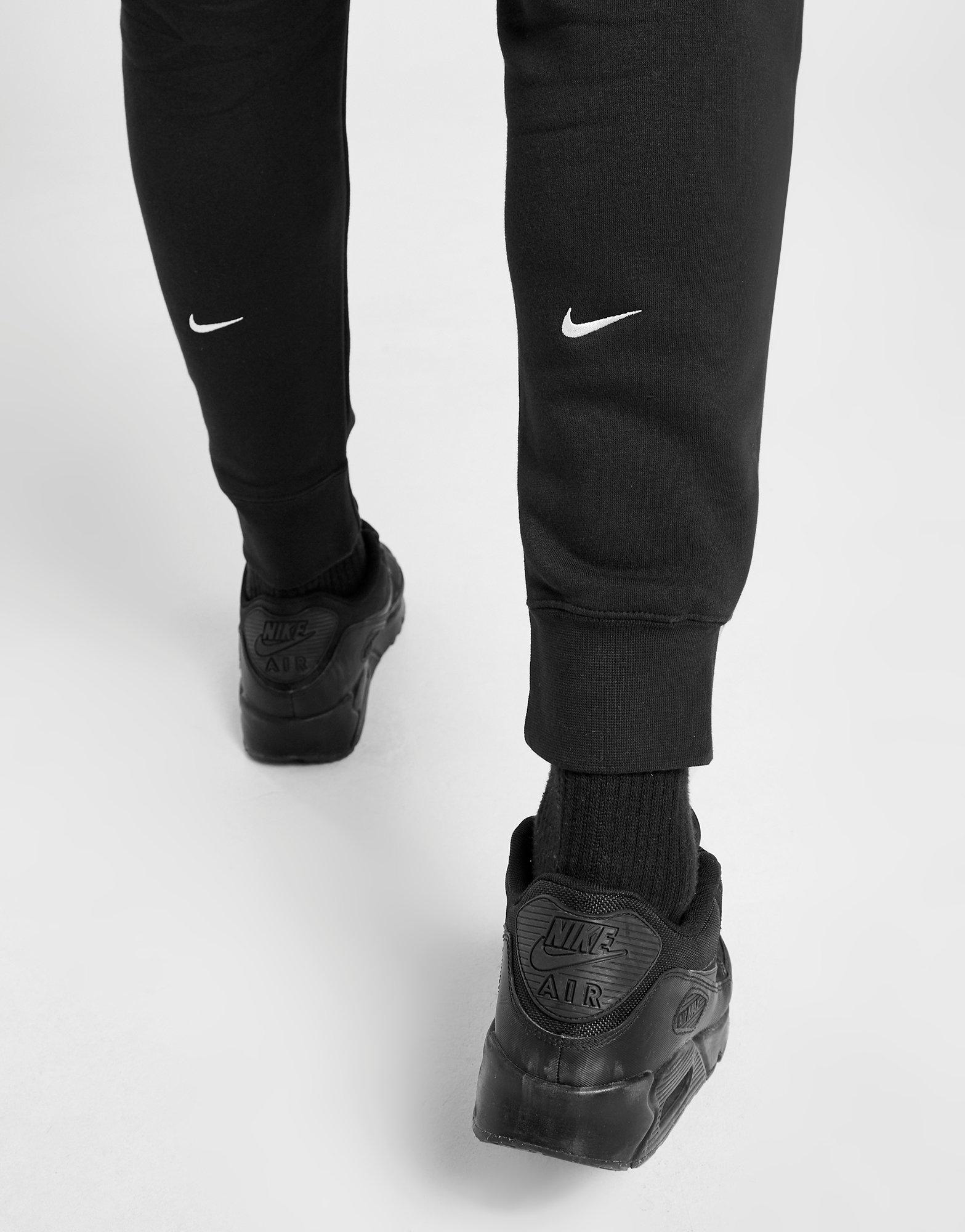 nike swoosh joggers