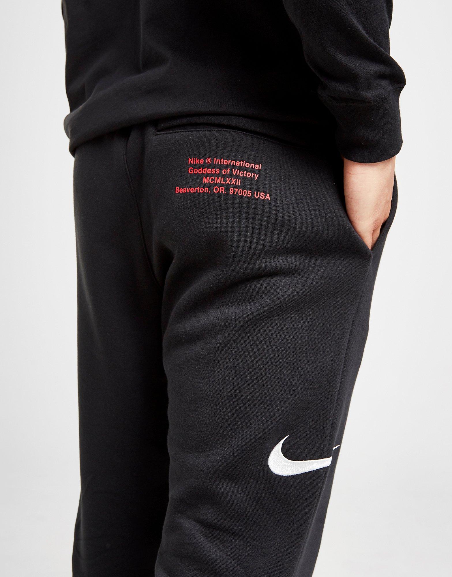 nike joggers swoosh