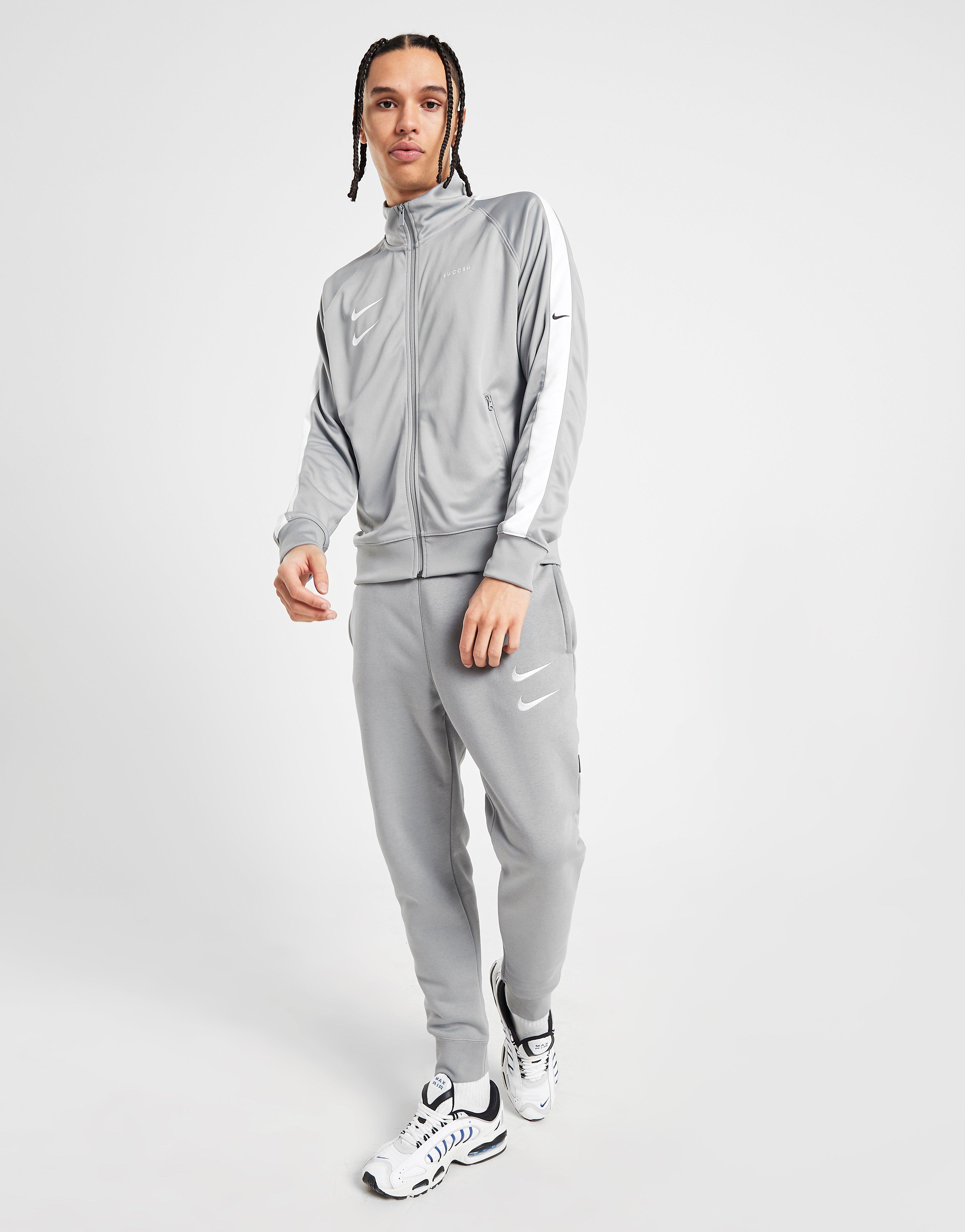 grey nike swoosh tracksuit