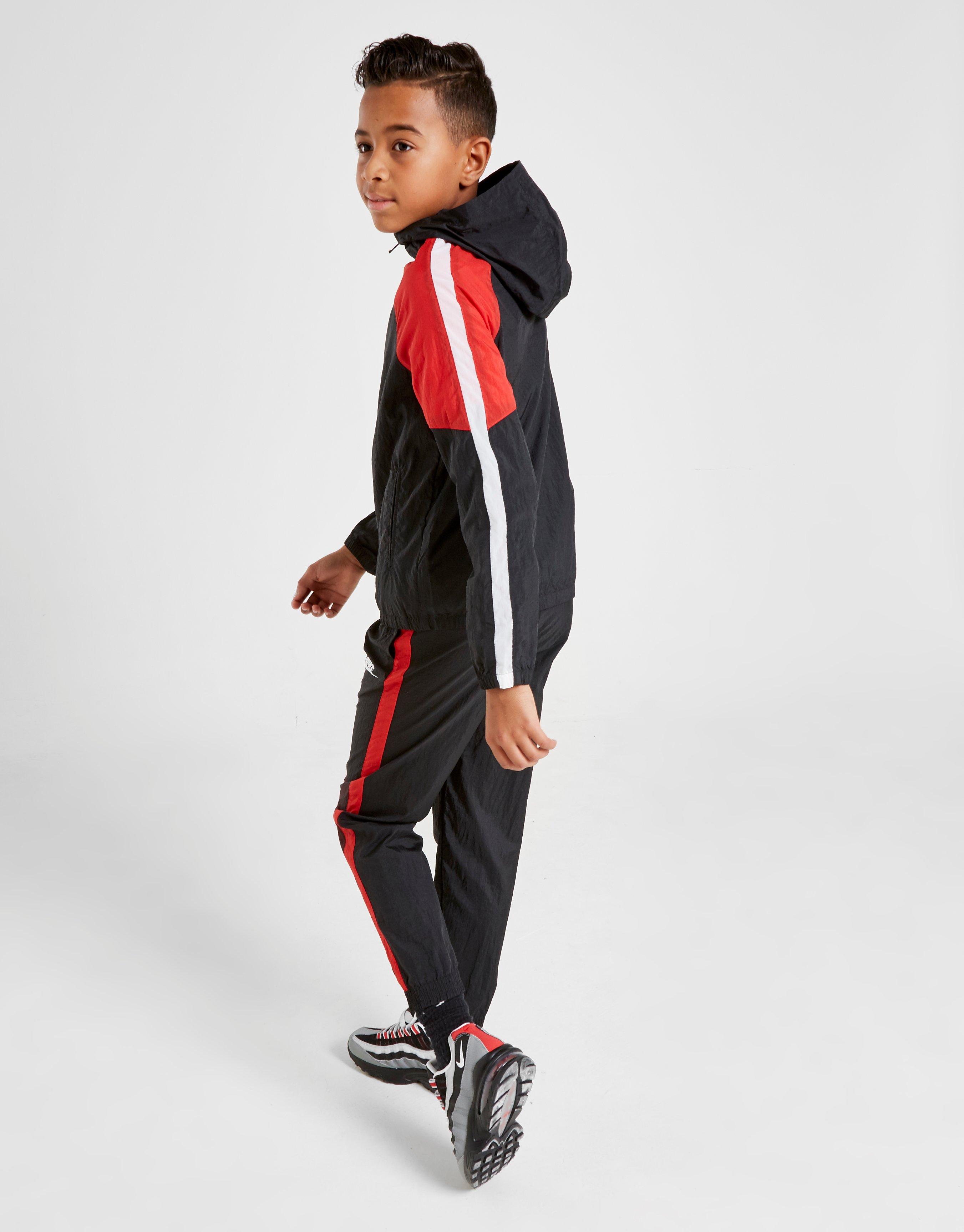 nike woven tracksuit junior
