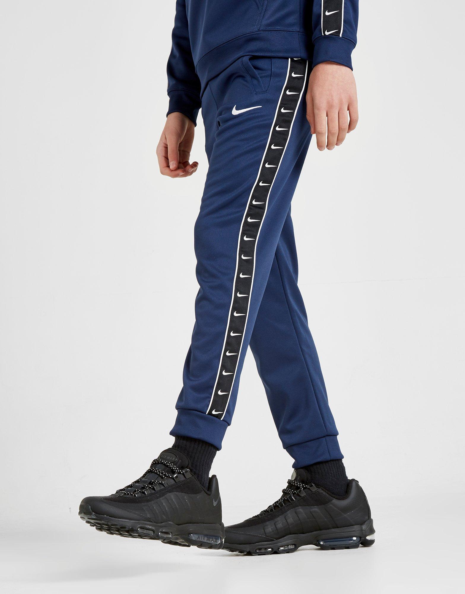 nike taped pants blue