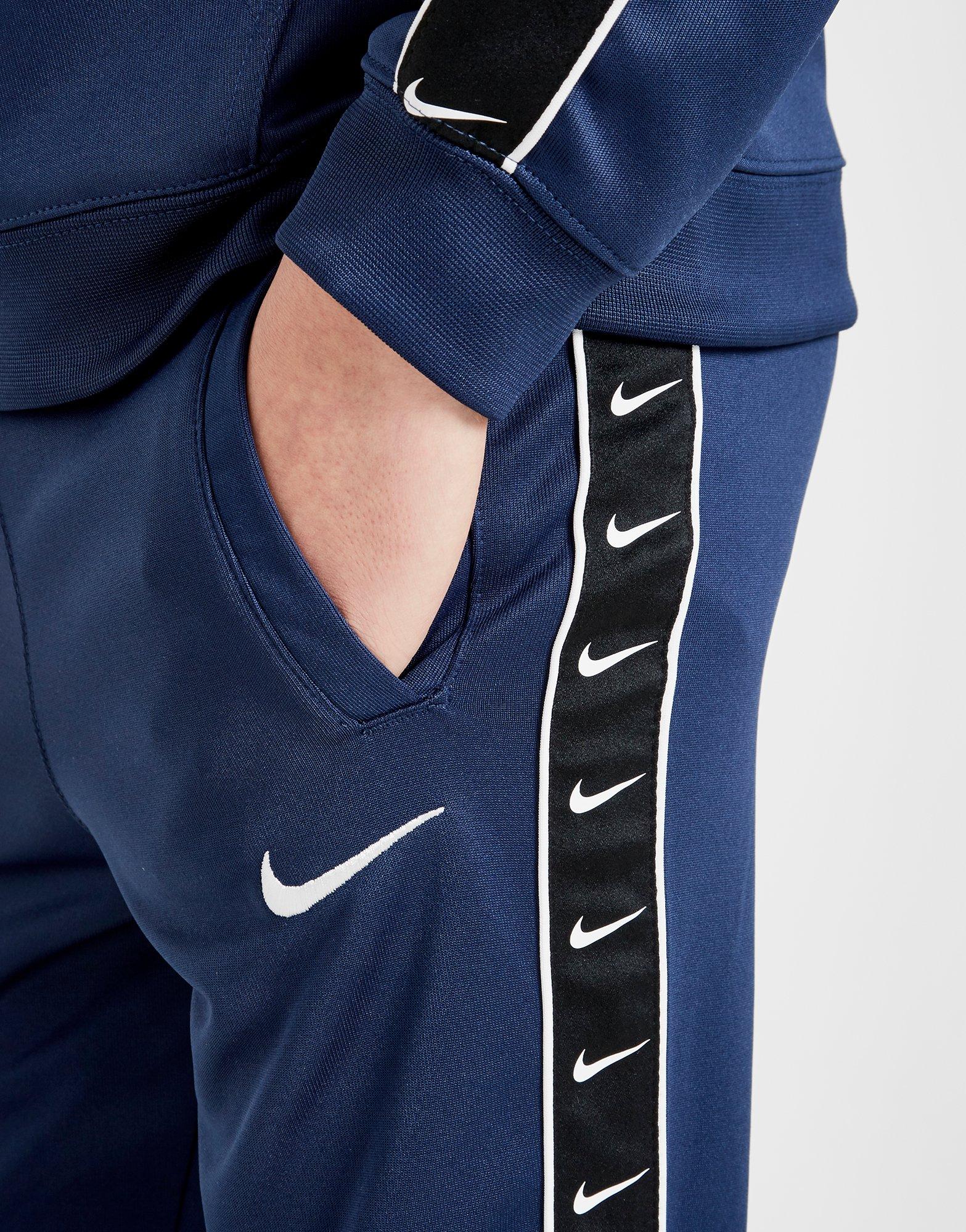 nike tape poly track pants junior