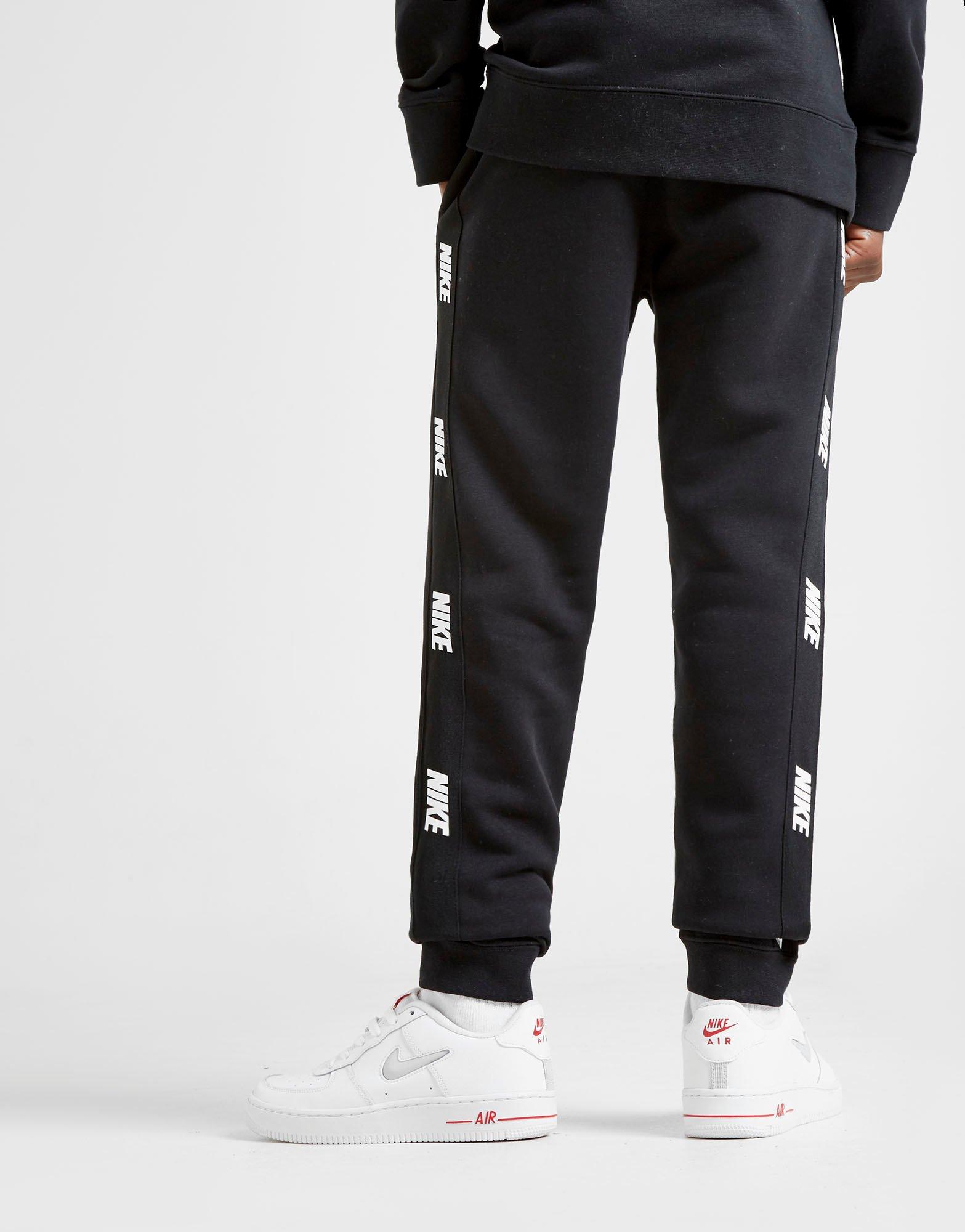 grey nike joggers junior