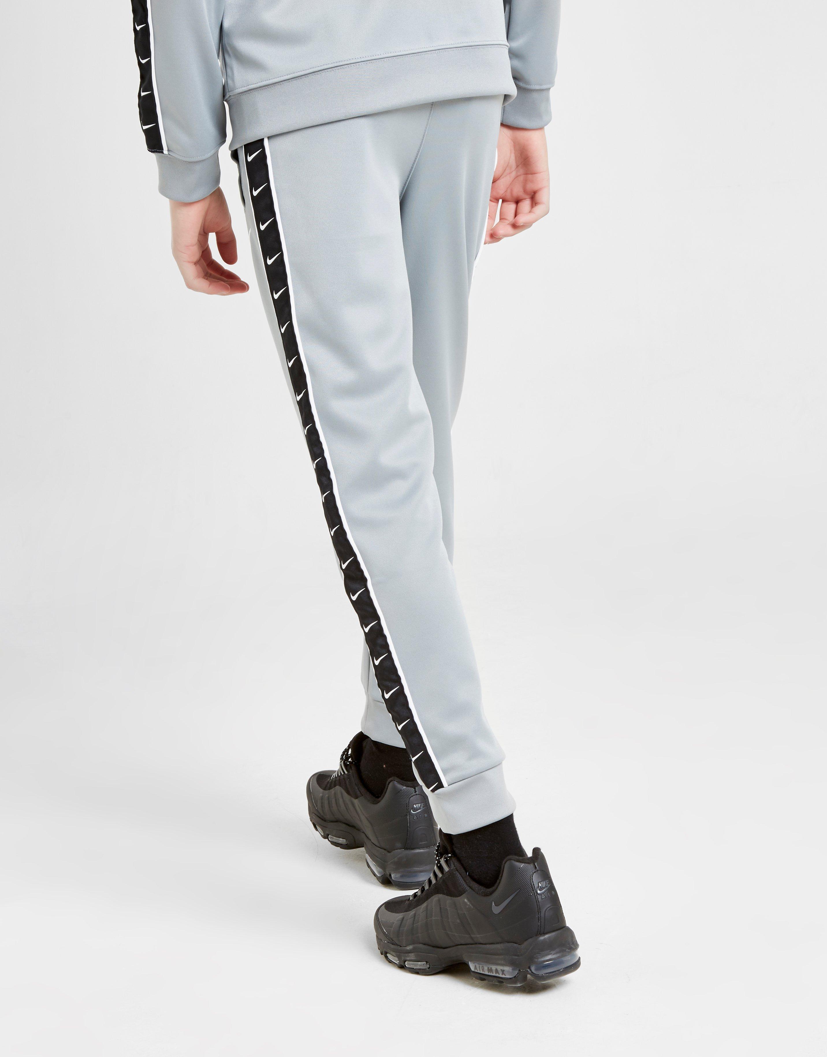 nike sportswear taped pant poly