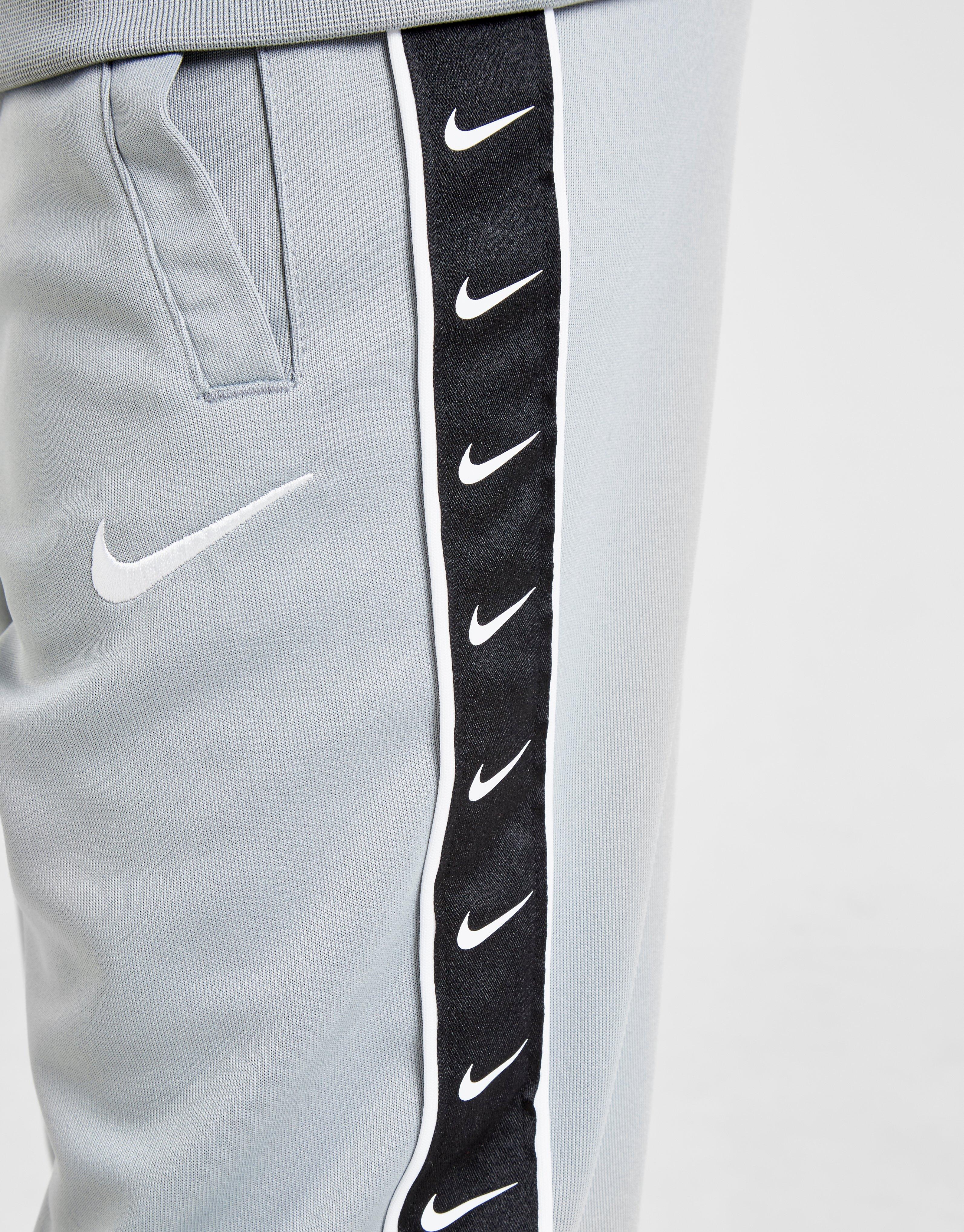 nike sportswear taped pant poly