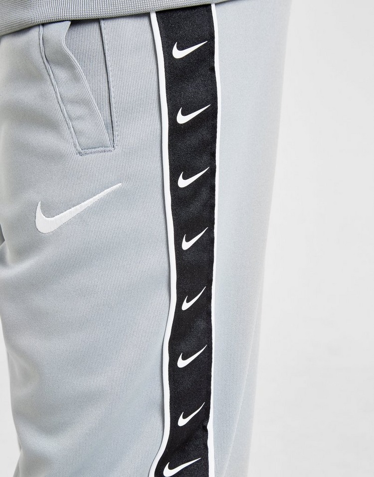 Buy Grey Nike Tape Poly Joggers Junior | JD Sports | JD Sports Ireland