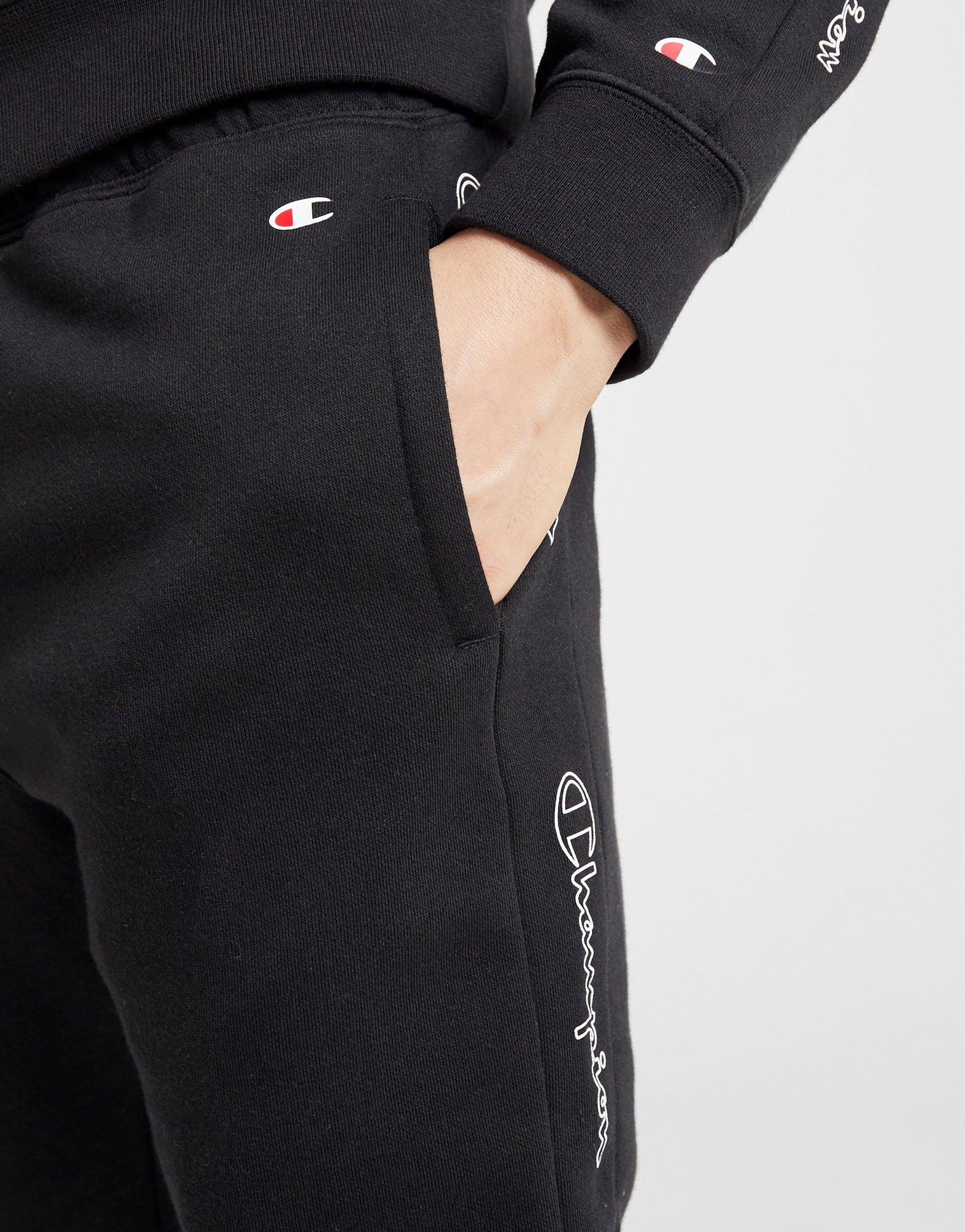 champion black and red taping track pants