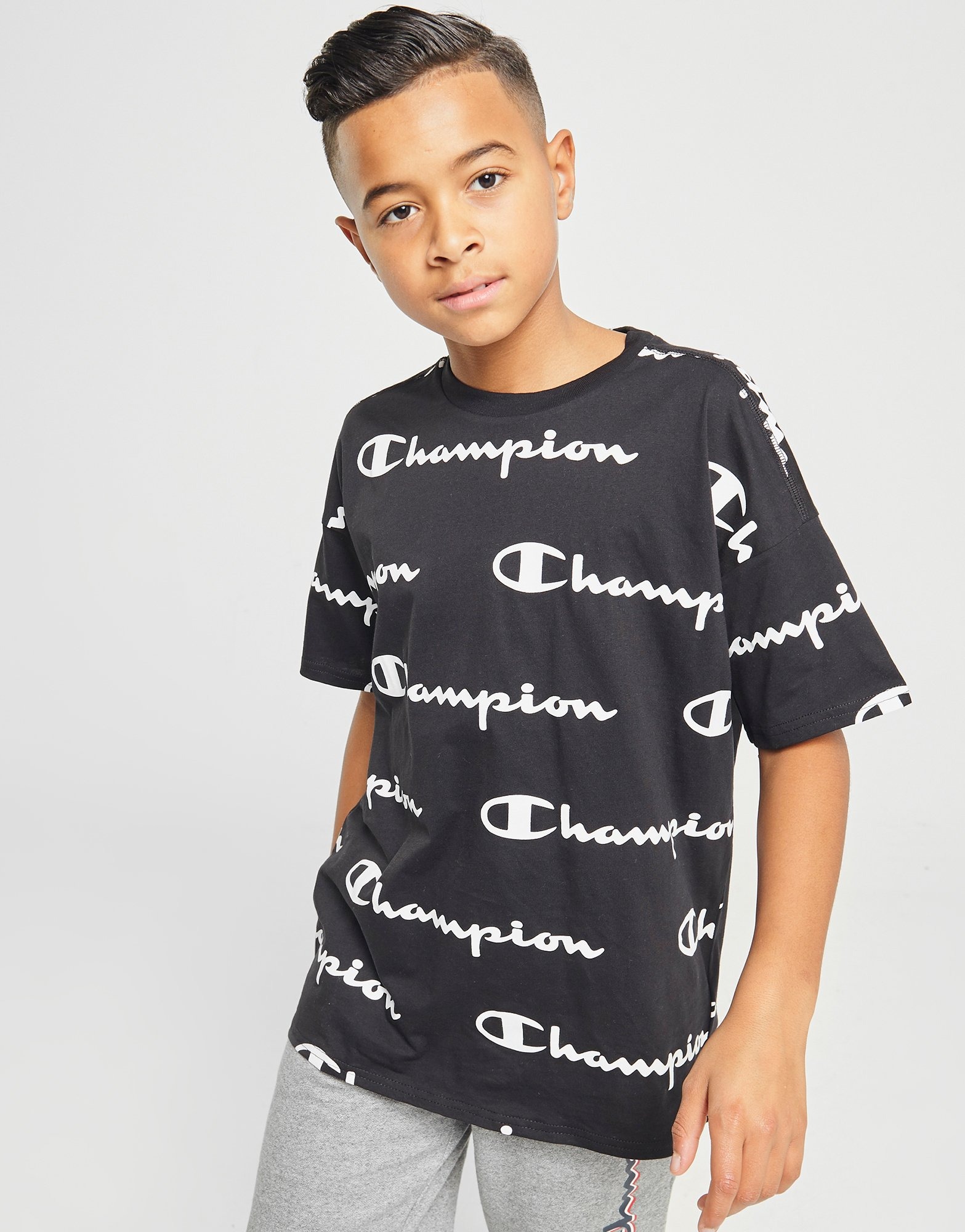 Compra Champion camiseta All Over Print Oversized júnior en Negro JD
