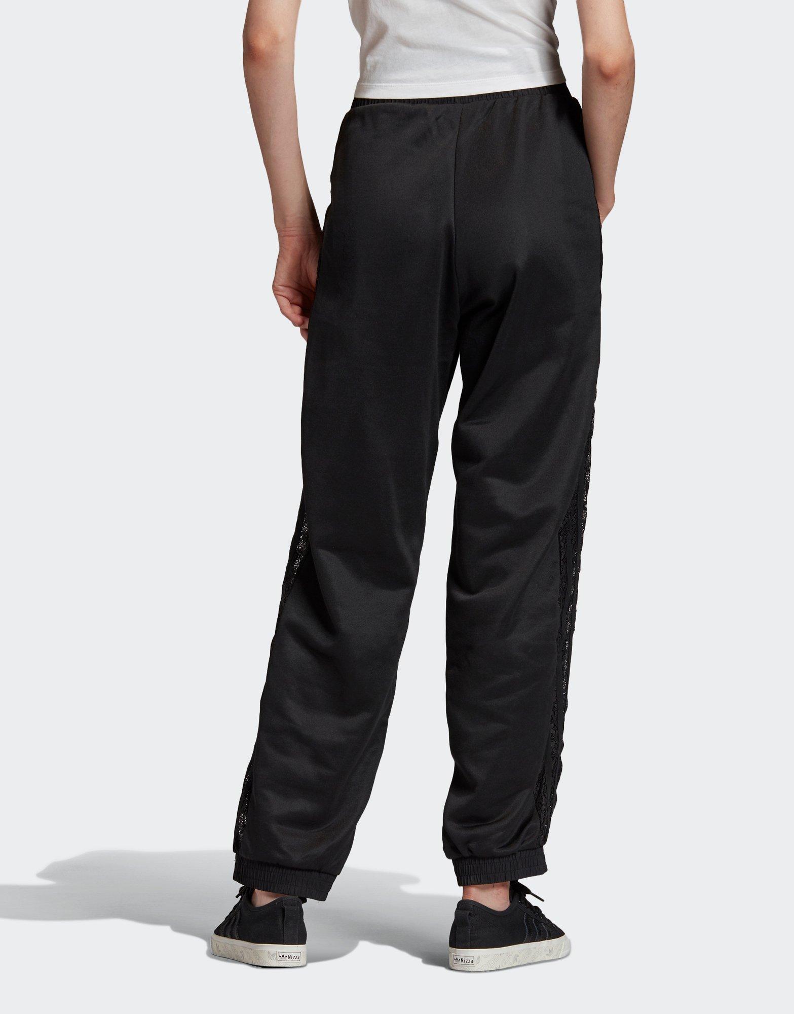 pantaloni a zampa adidas