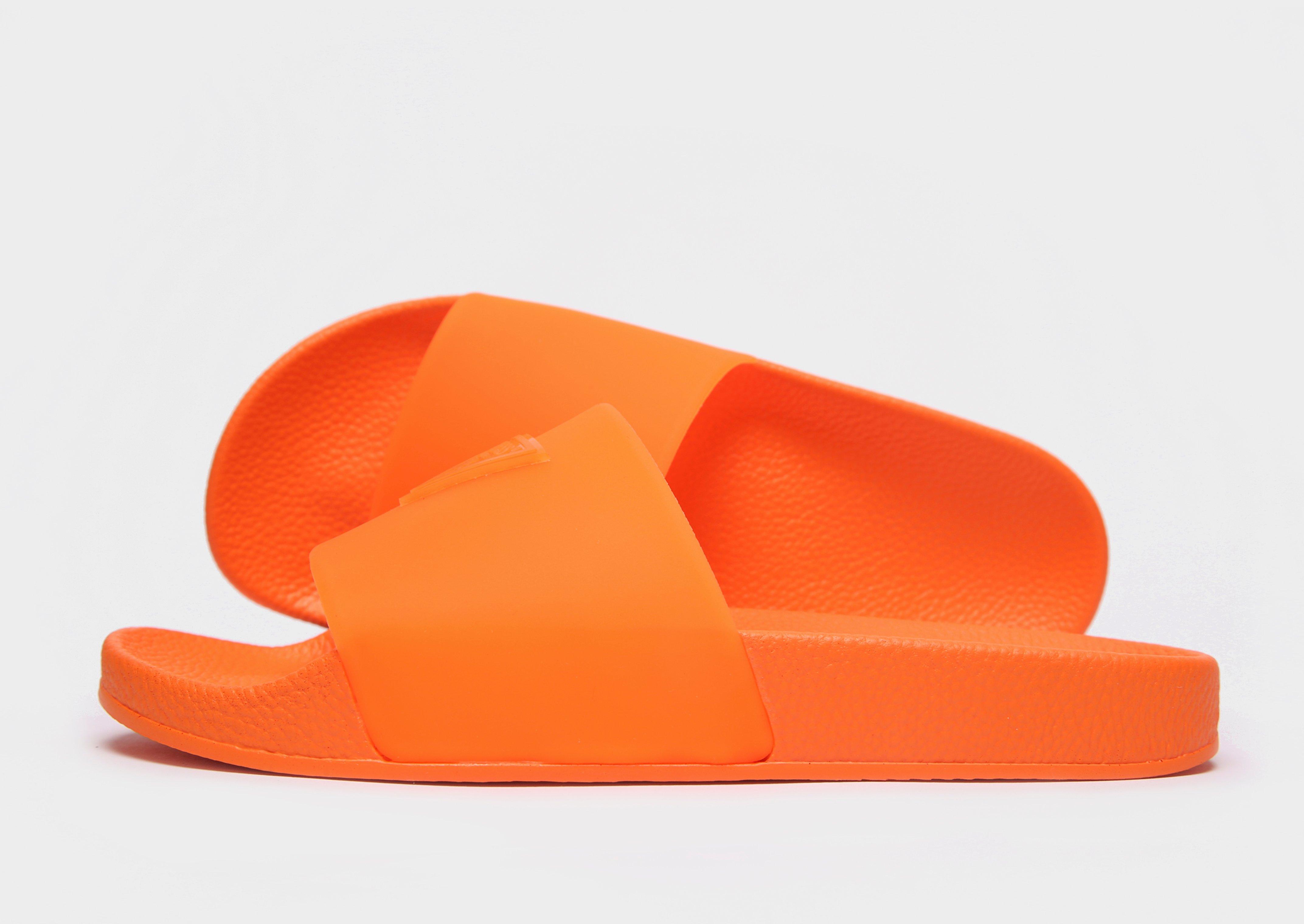 neon orange nike slides