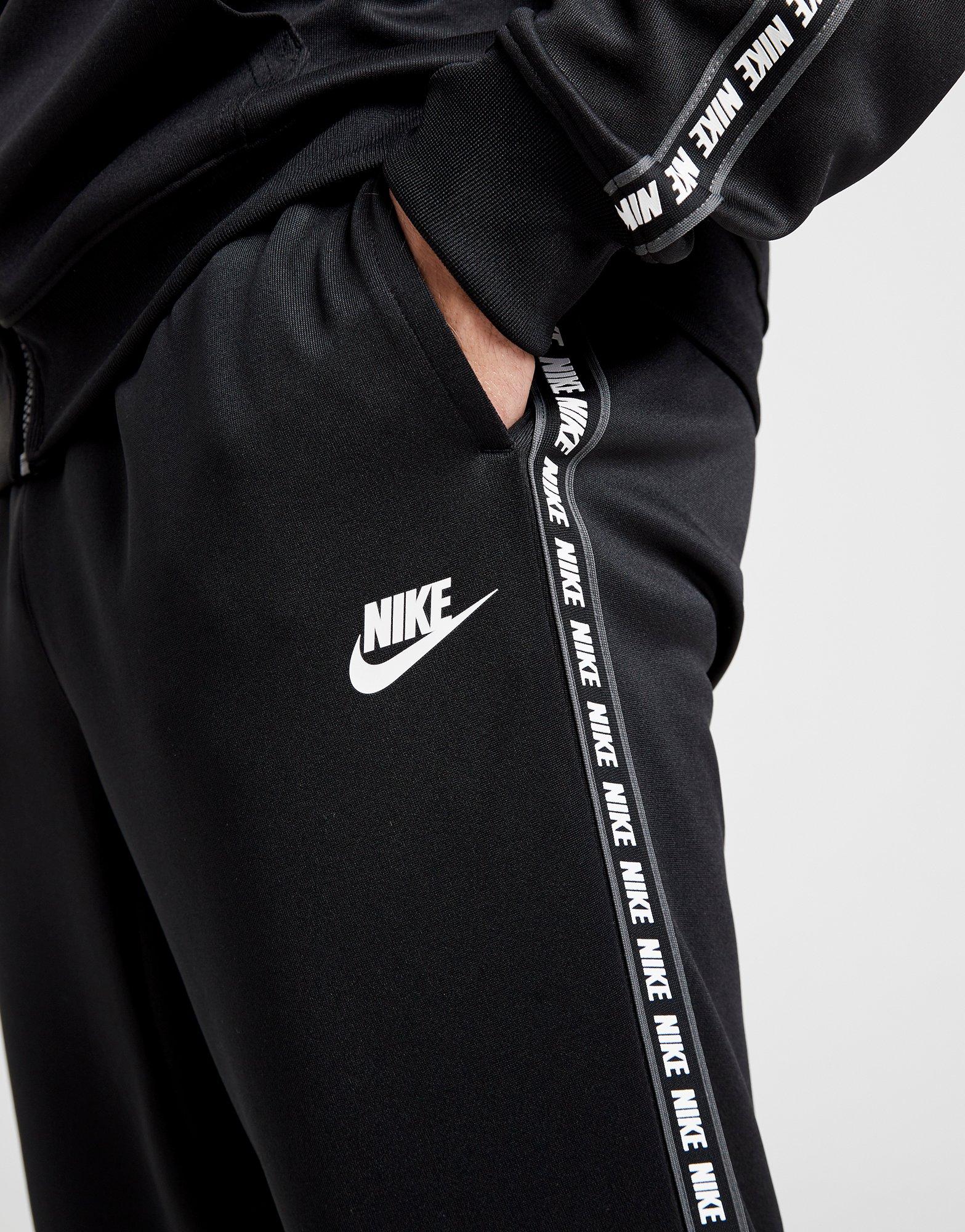 nike repeat print track pants