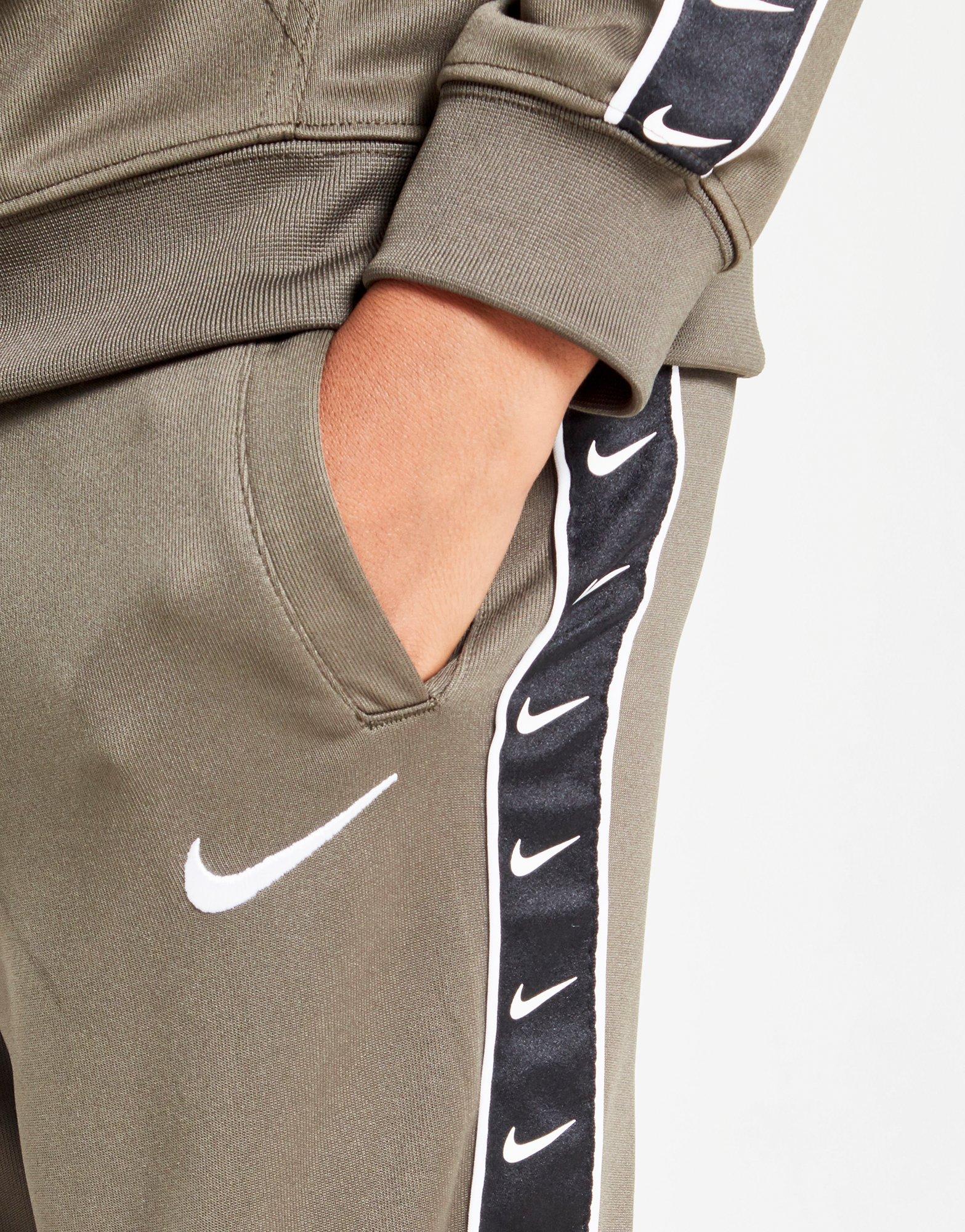 pantalon nike taped poly