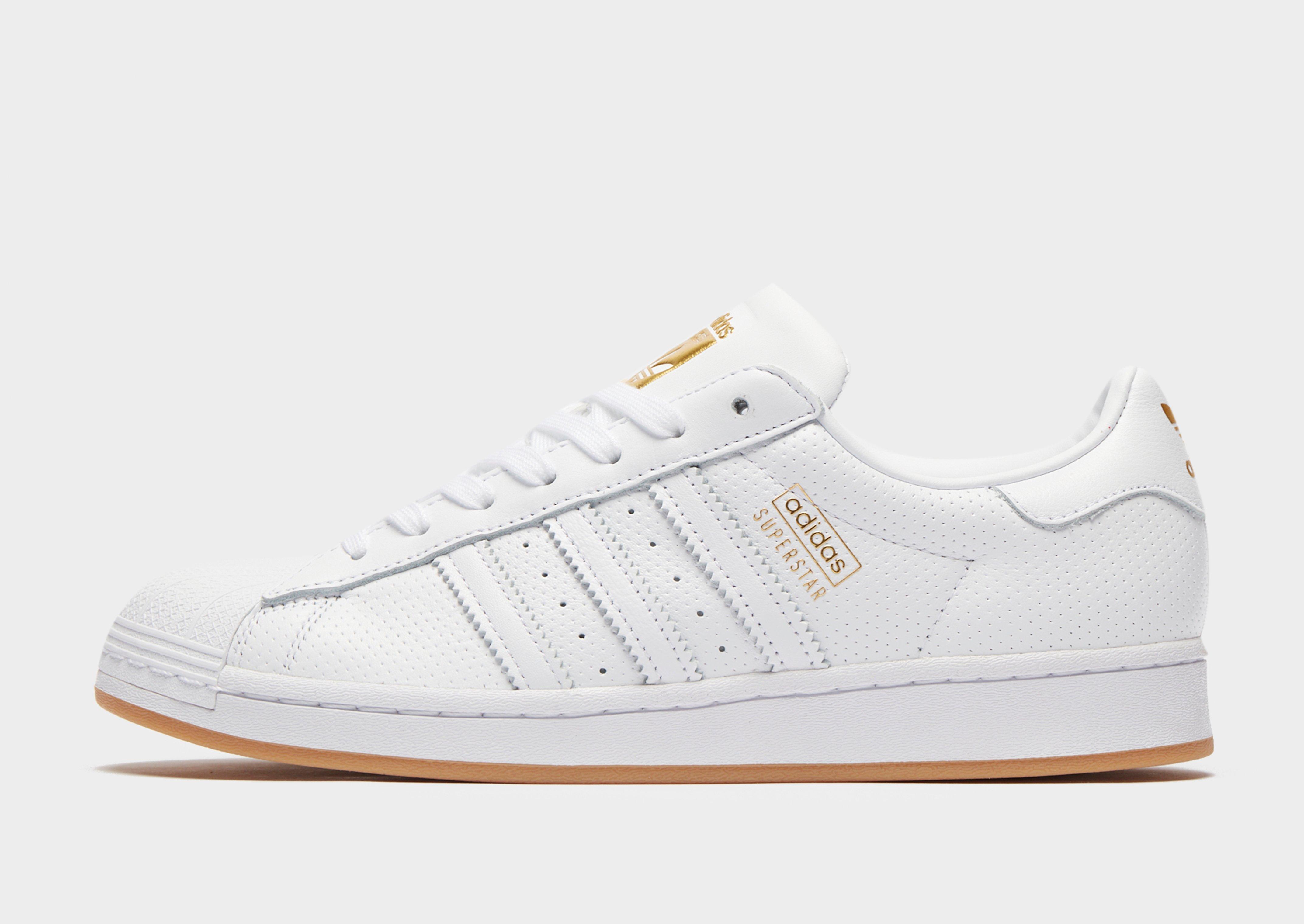 adidas superstar douradas