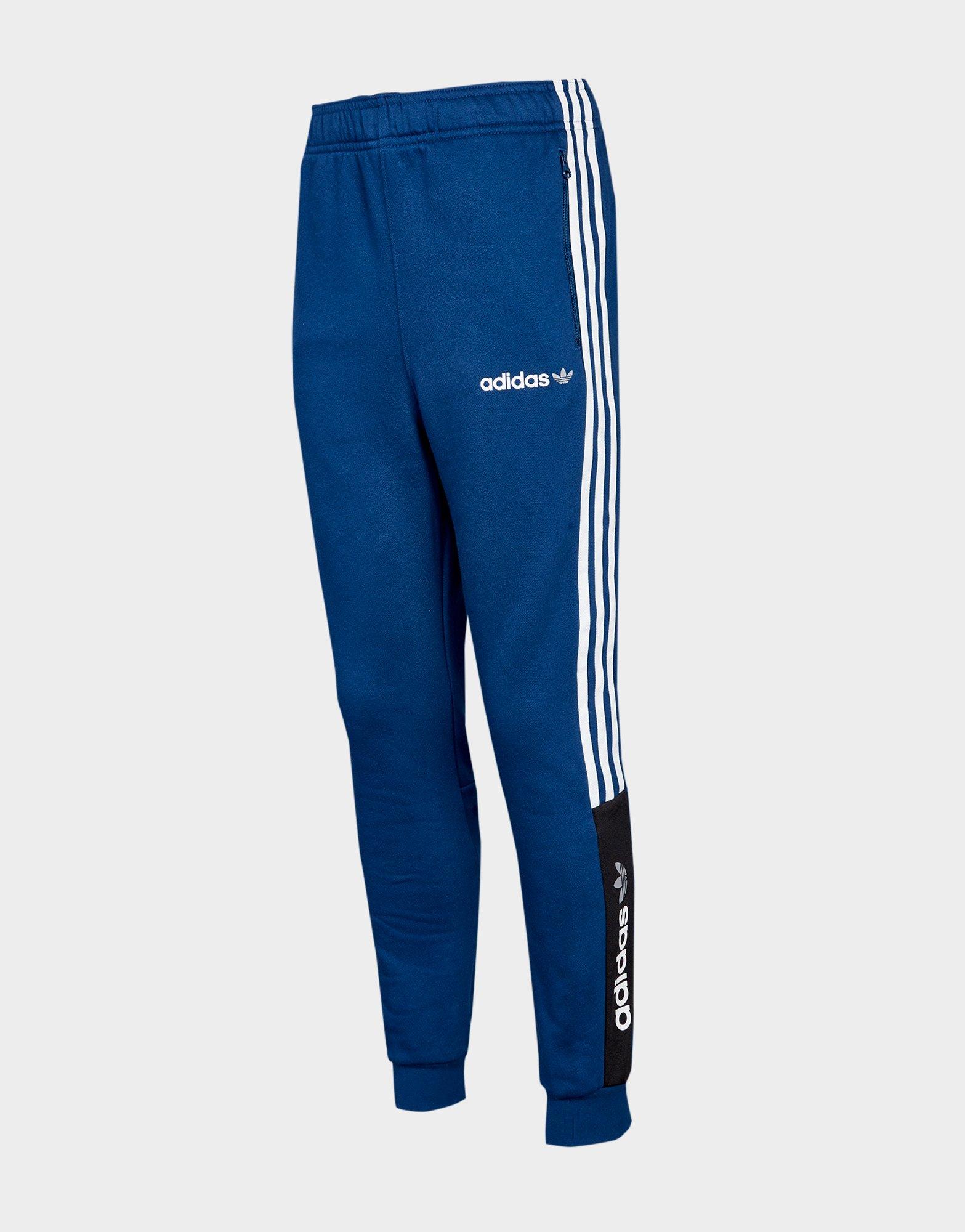 Compra adidas Originals pantalón de chándal Challenger júnior en Azul
