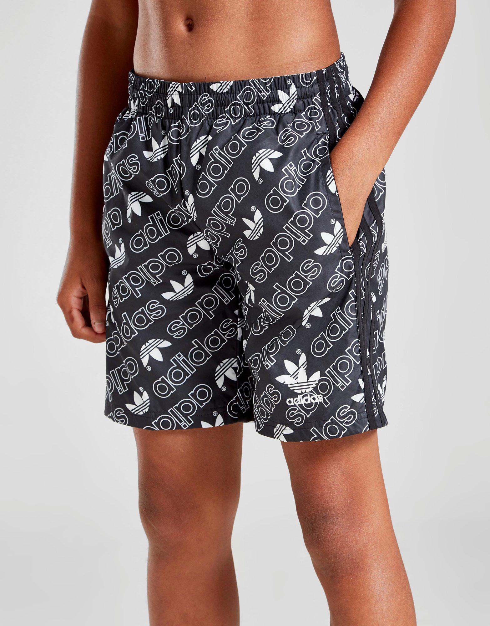 adidas allover print swim shorts