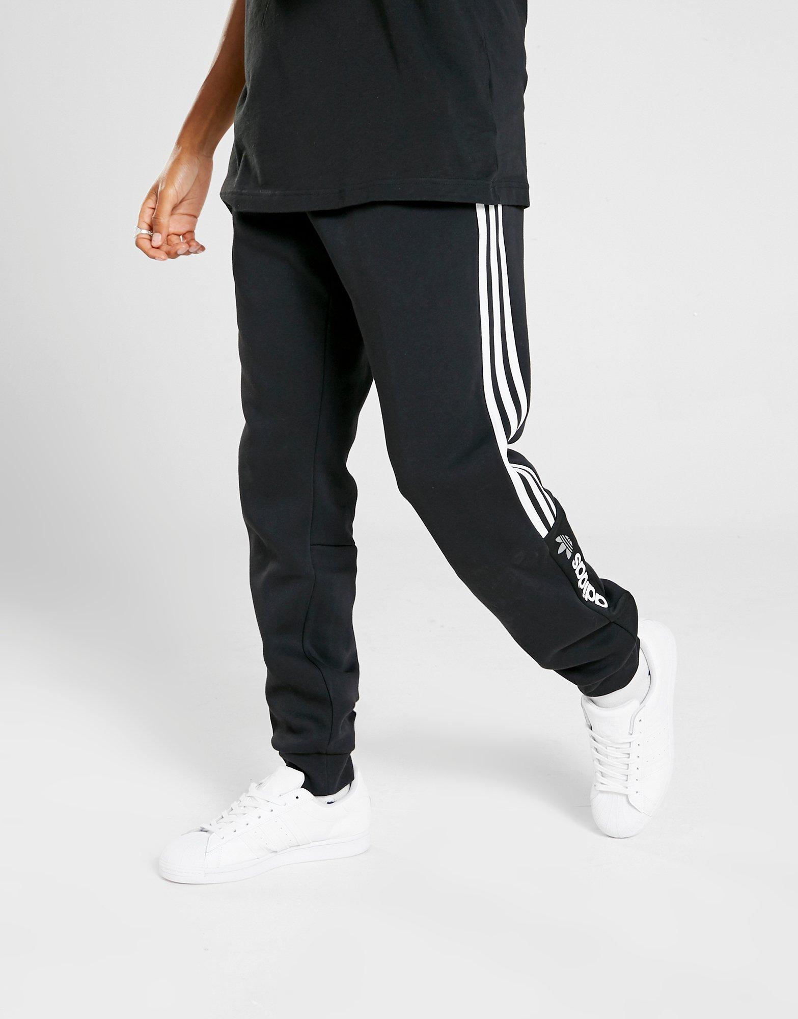 Compra adidas Originals pantalón de chándal ZX en Negro