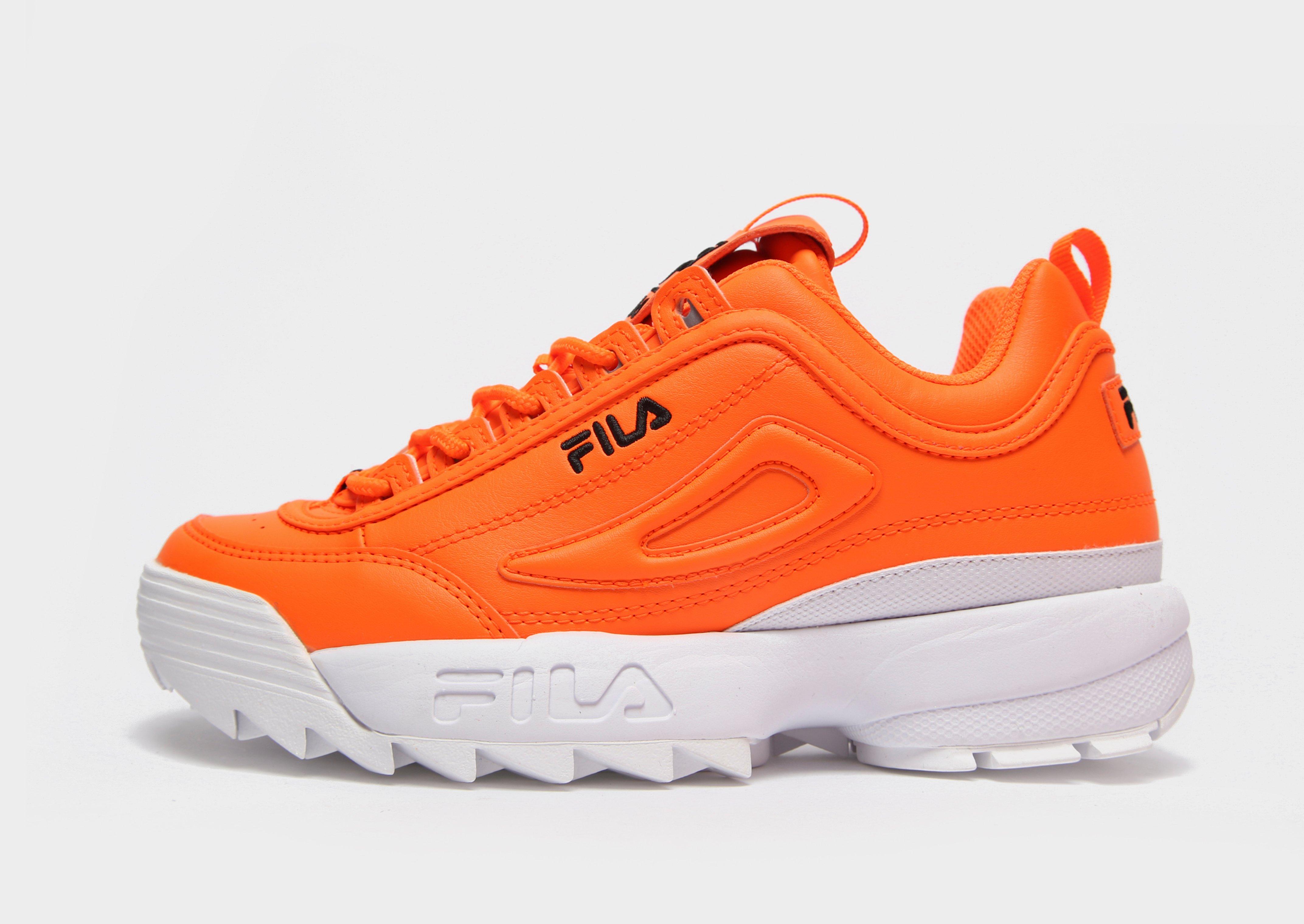 orange and white fila shoes