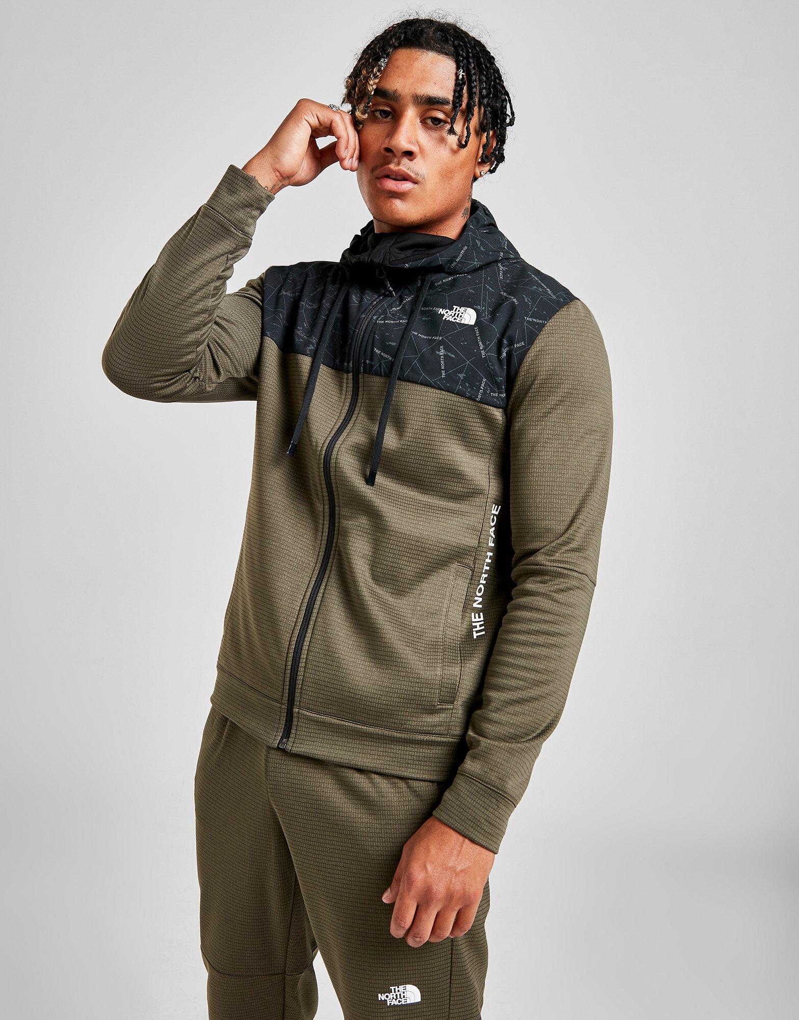 green and black north face tracksuit