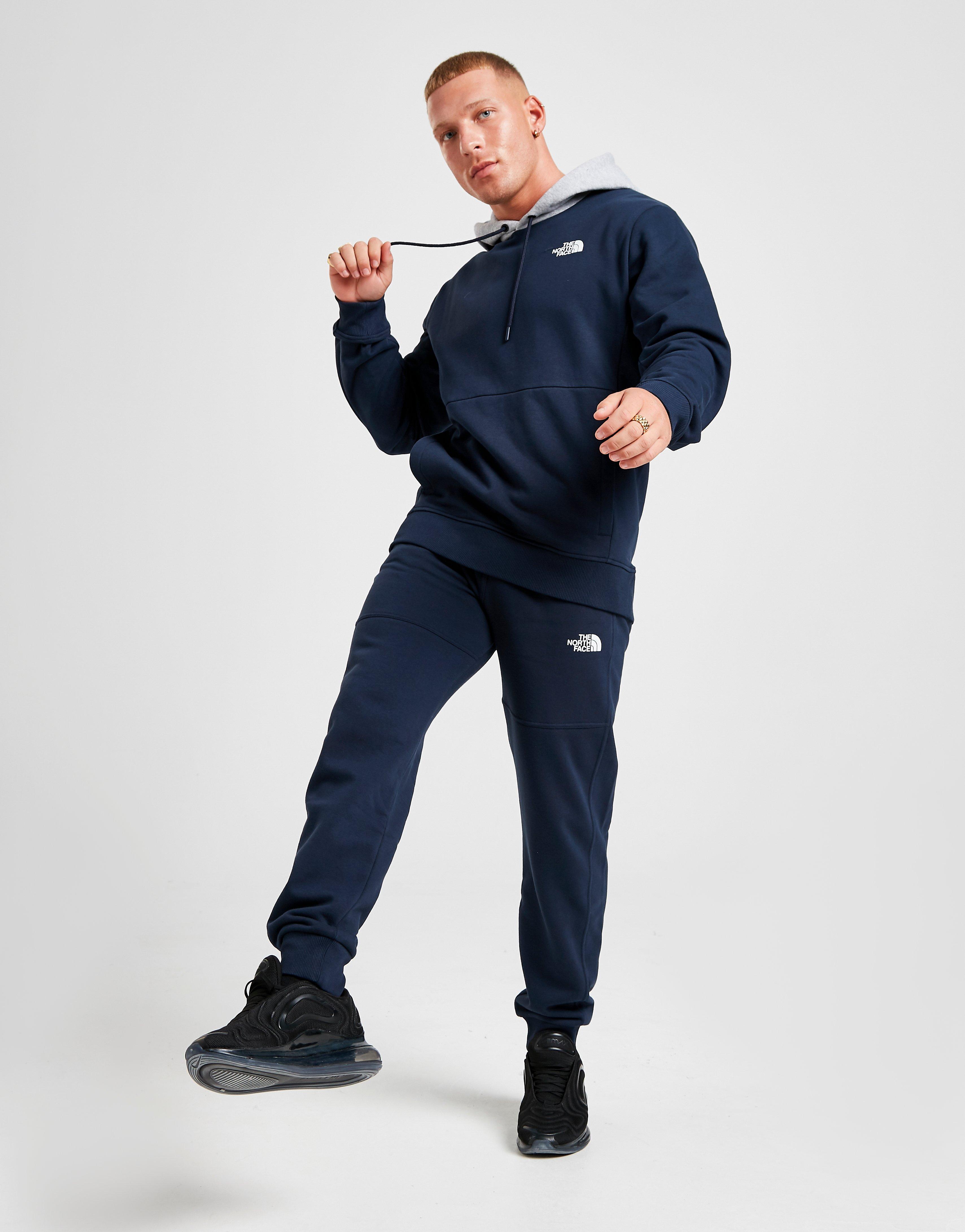 blue and grey north face tracksuit