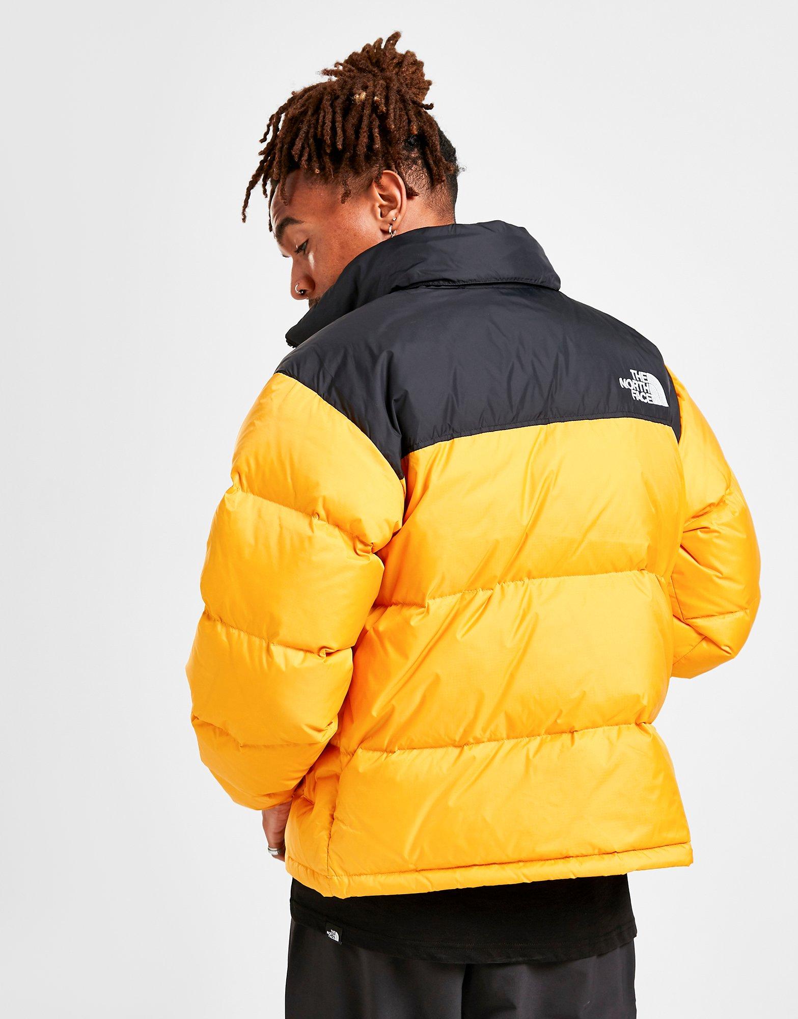 yellow north face puffer jacket