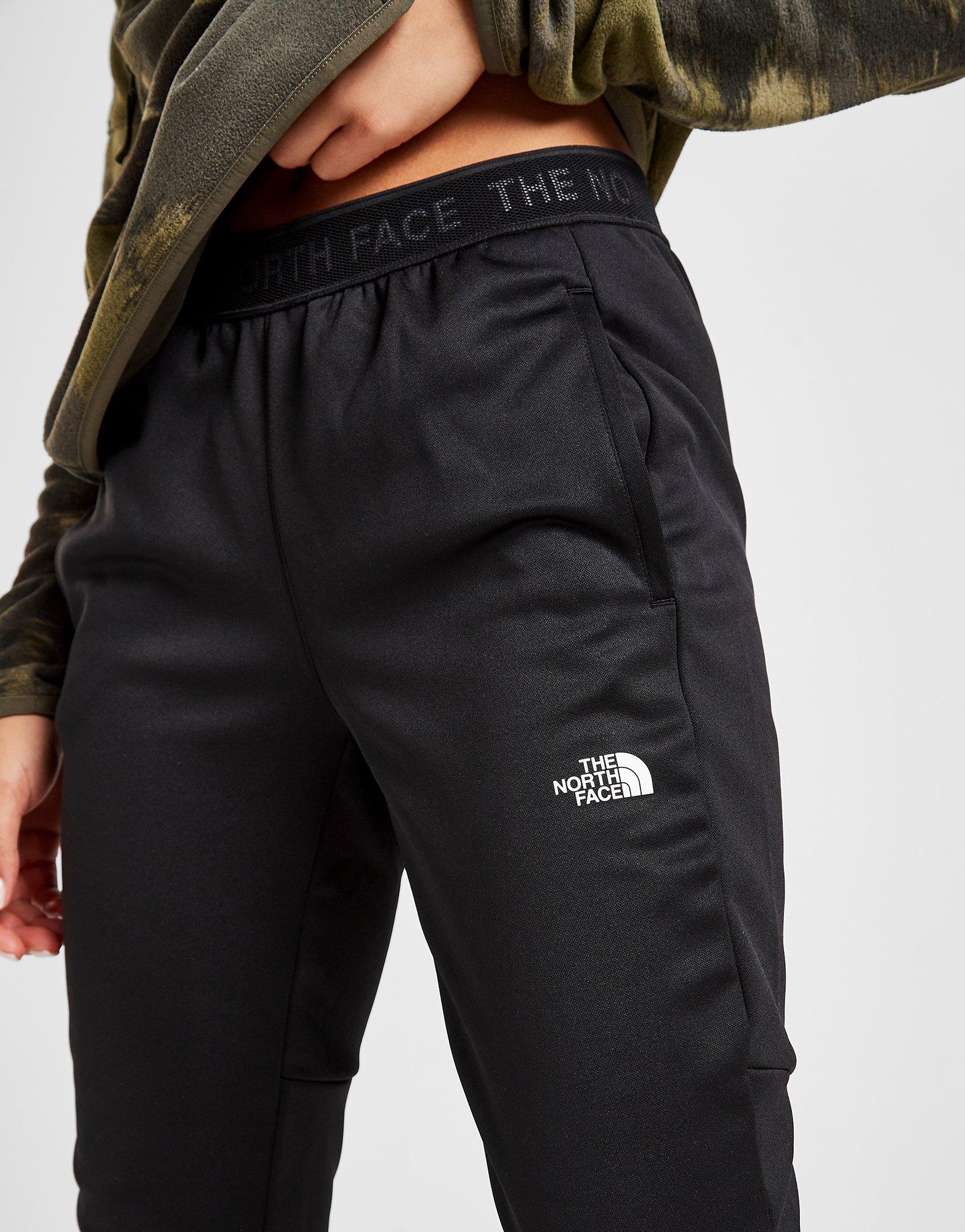 train n logo track pants
