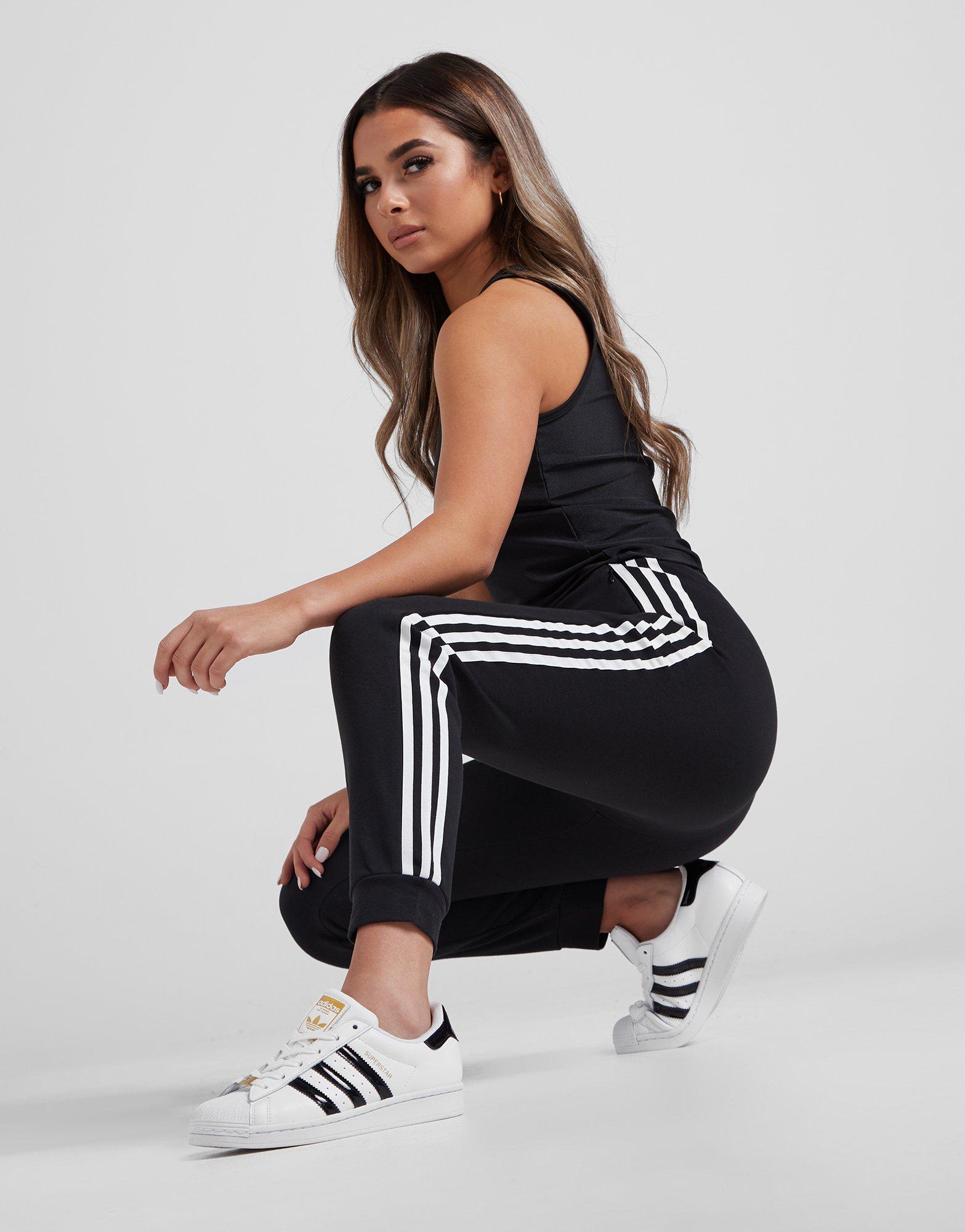 adidas originals superstar 3 stripe skinny joggers in black