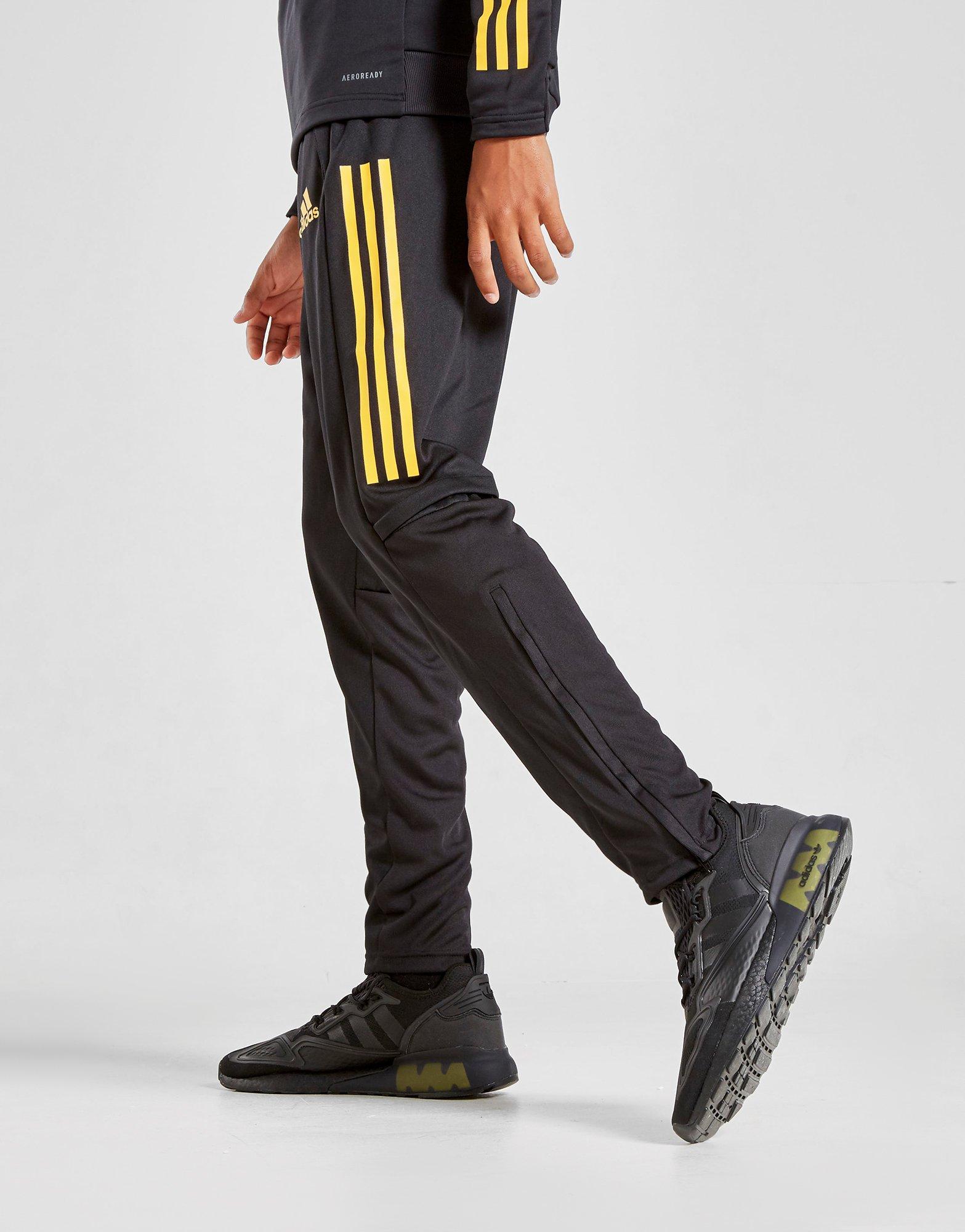 pantaloni adidas strisce bianche