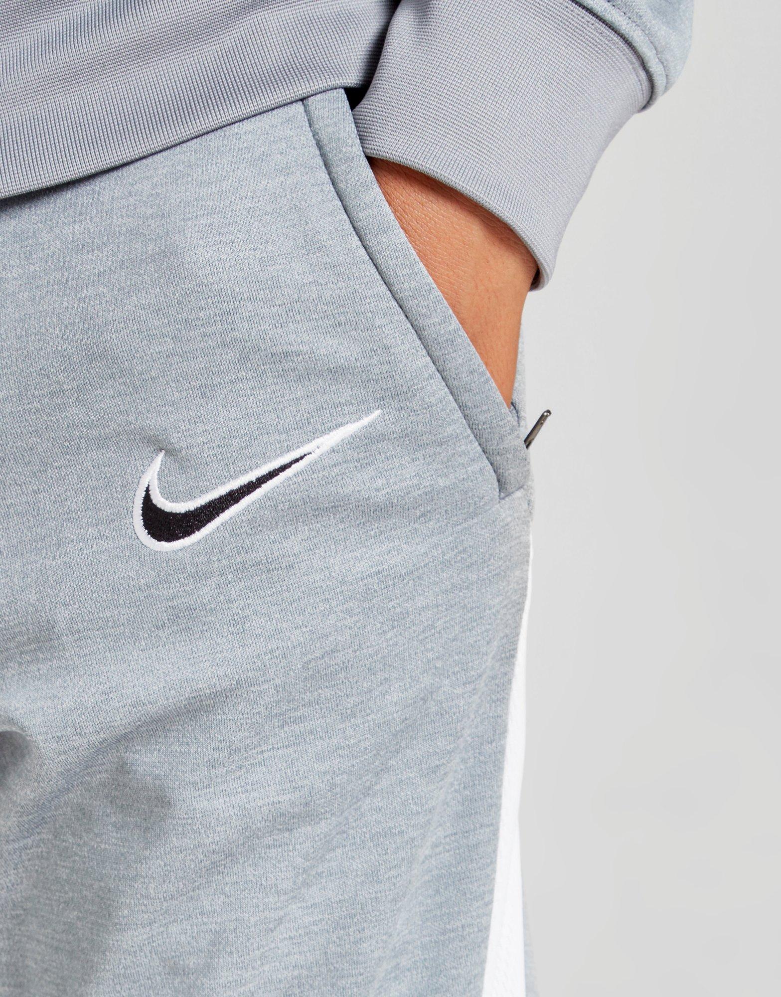 grey nike tracksuit bottoms junior