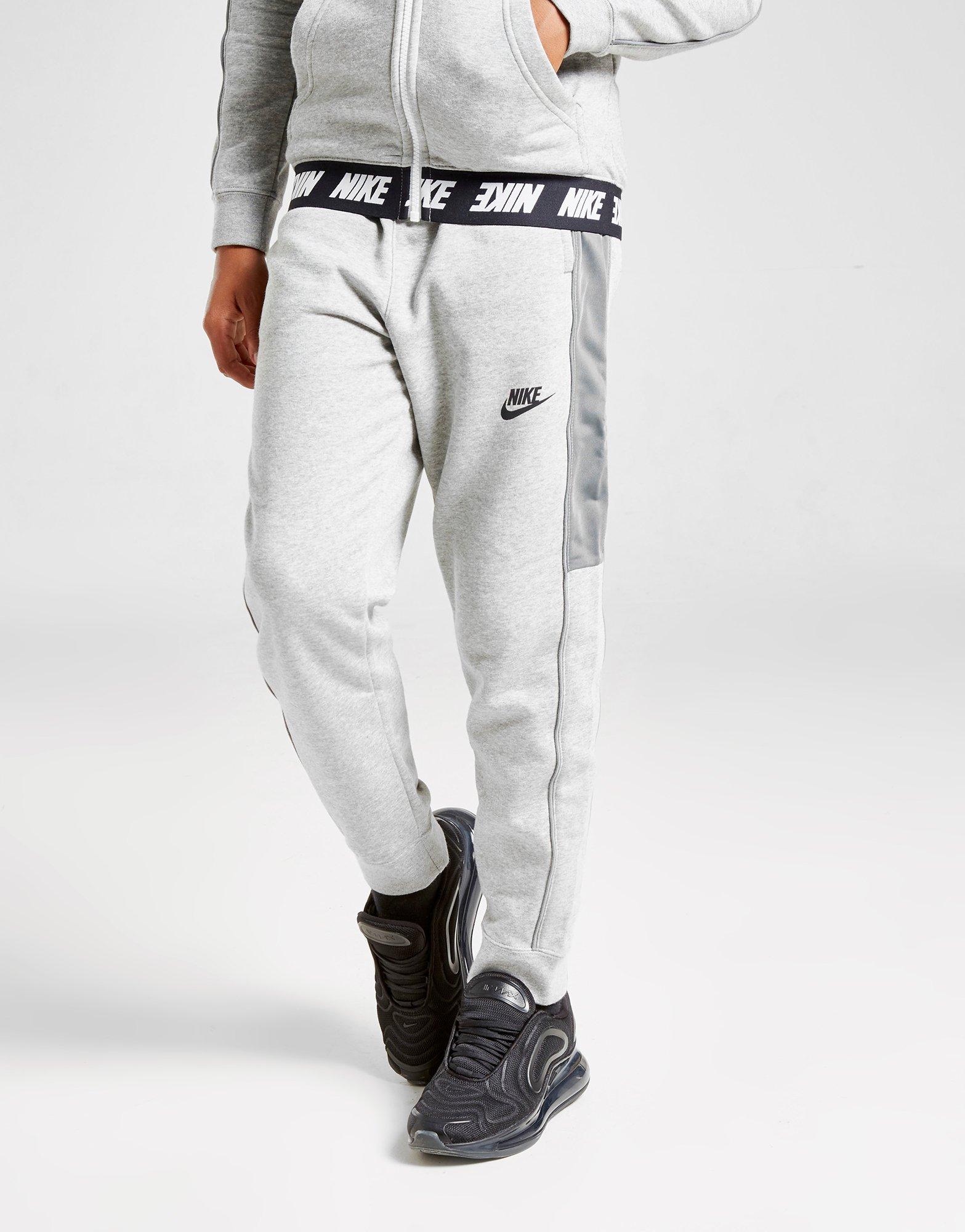 Compra Nike pantalón de chándal Hybrid júnior en Gris