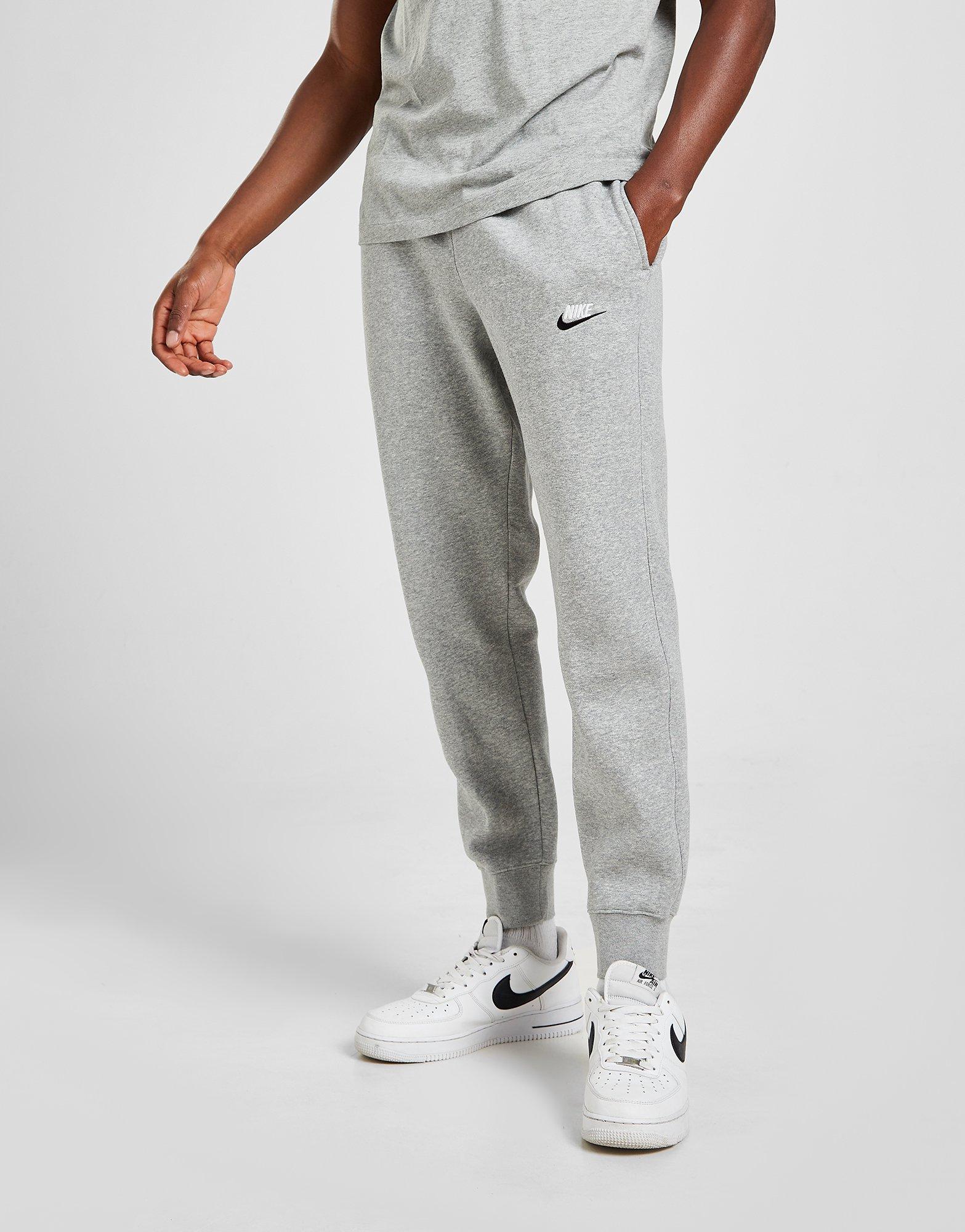 nike pantalon gris